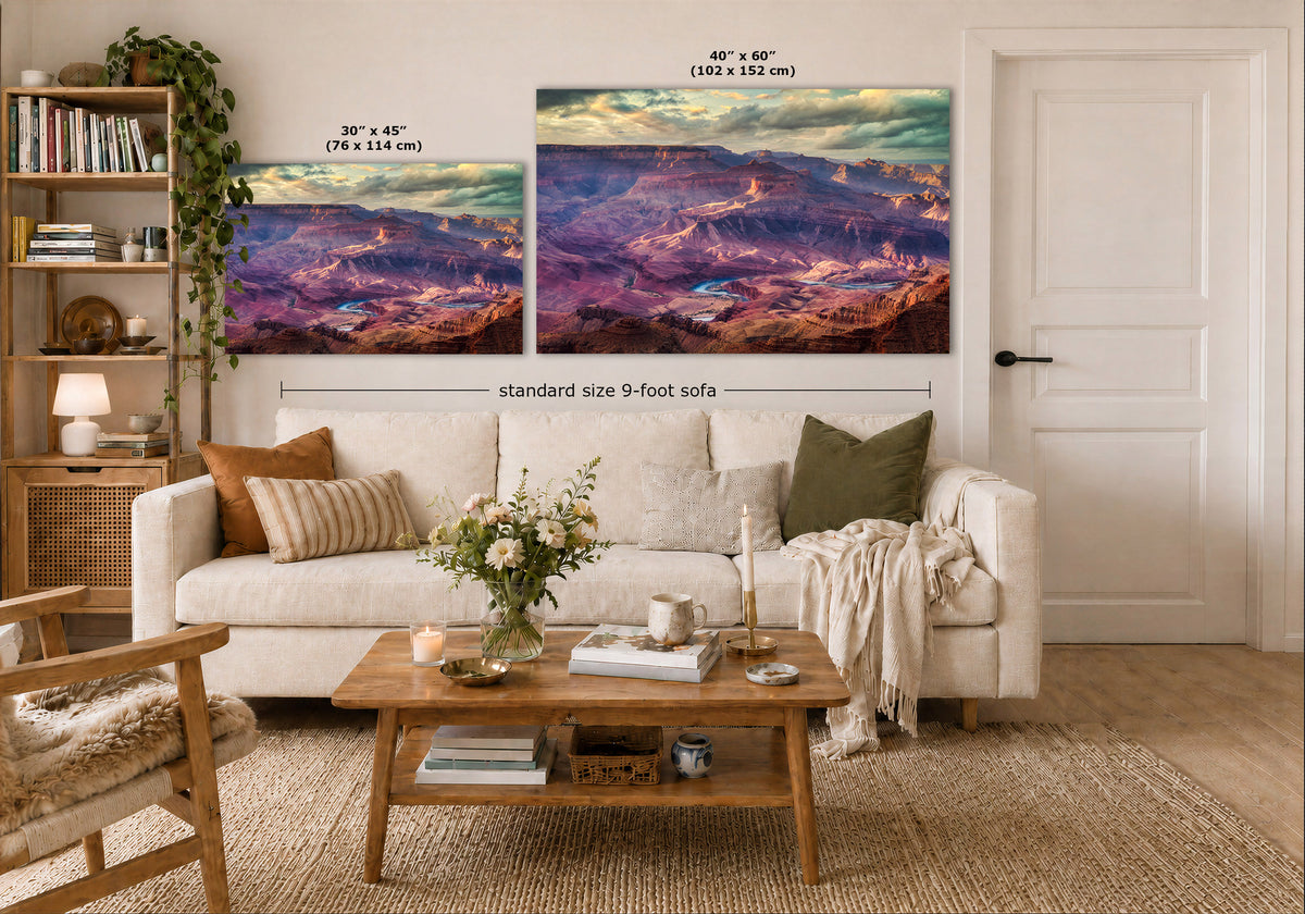 Two landscape wall art prints displayed above a white sofa in a styled living room. The left print is labeled 30 x 45 inches, and the larger right print is labeled 40 x 60 inches.