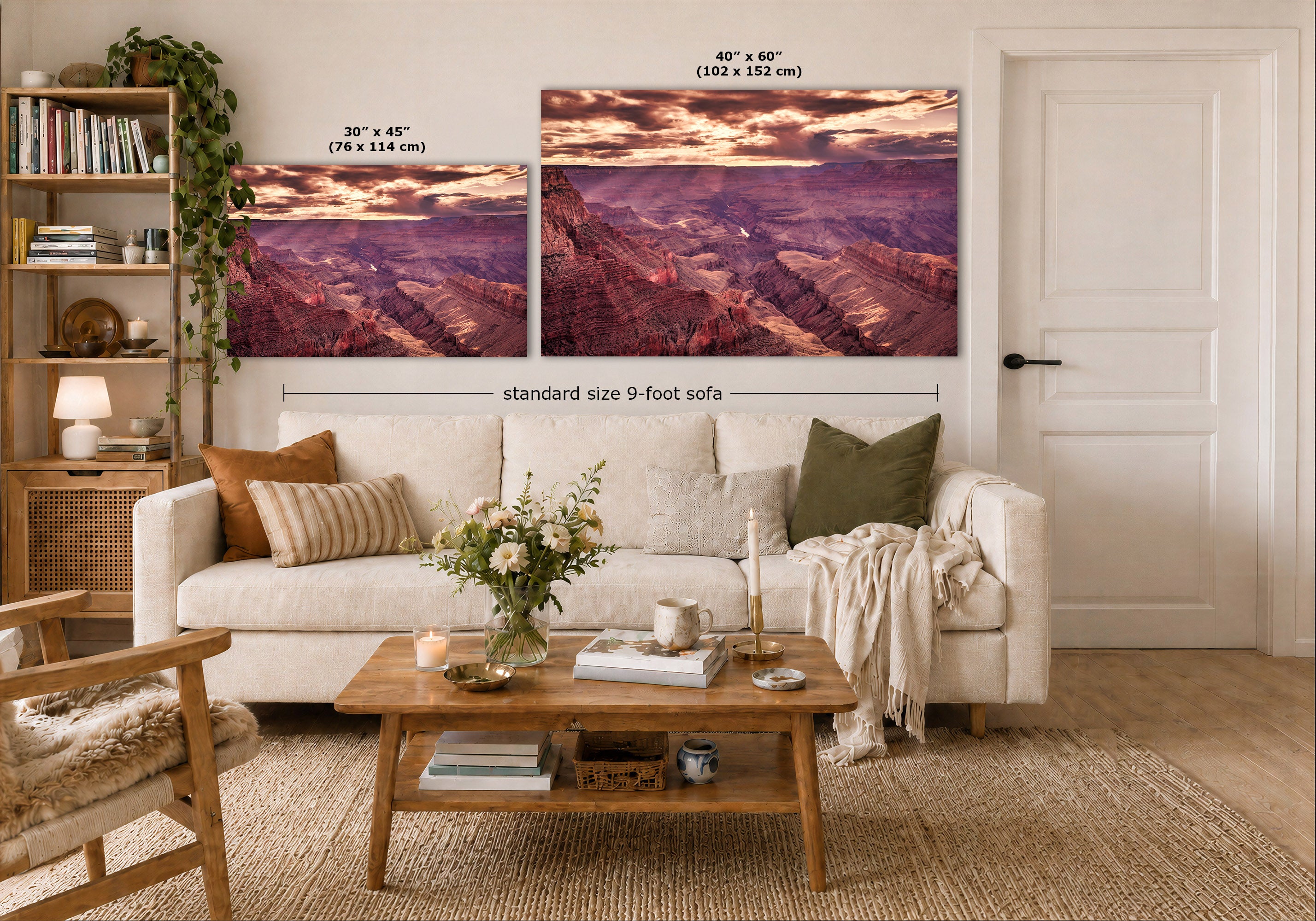 Two large wall art prints showing a canyon landscape in warm sunset tones, displayed above a white sofa in a styled living room. Text labels indicate the dimensions of the prints and a standard size 9-foot sofa.