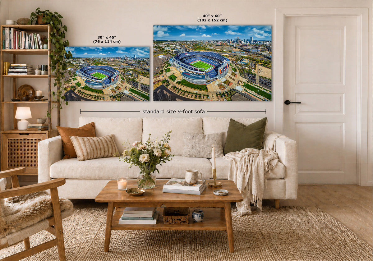 A staged living room shows a large wall mural or two art prints depicting an aerial stadium scene, with dimension labels indicating 30 x 45 in and 40 x 60 in sizes. The room includes a white sofa, wooden coffee table, shelving, and a door.