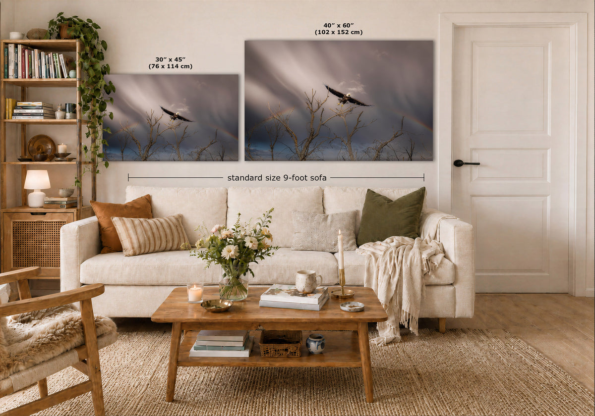 A styled living room showing two large wall art prints above a white sofa, with overlaid size labels: 30 x 45 inches for the smaller print and 40 x 60 inches for the larger print, plus a note for a standard size 9-foot sofa.