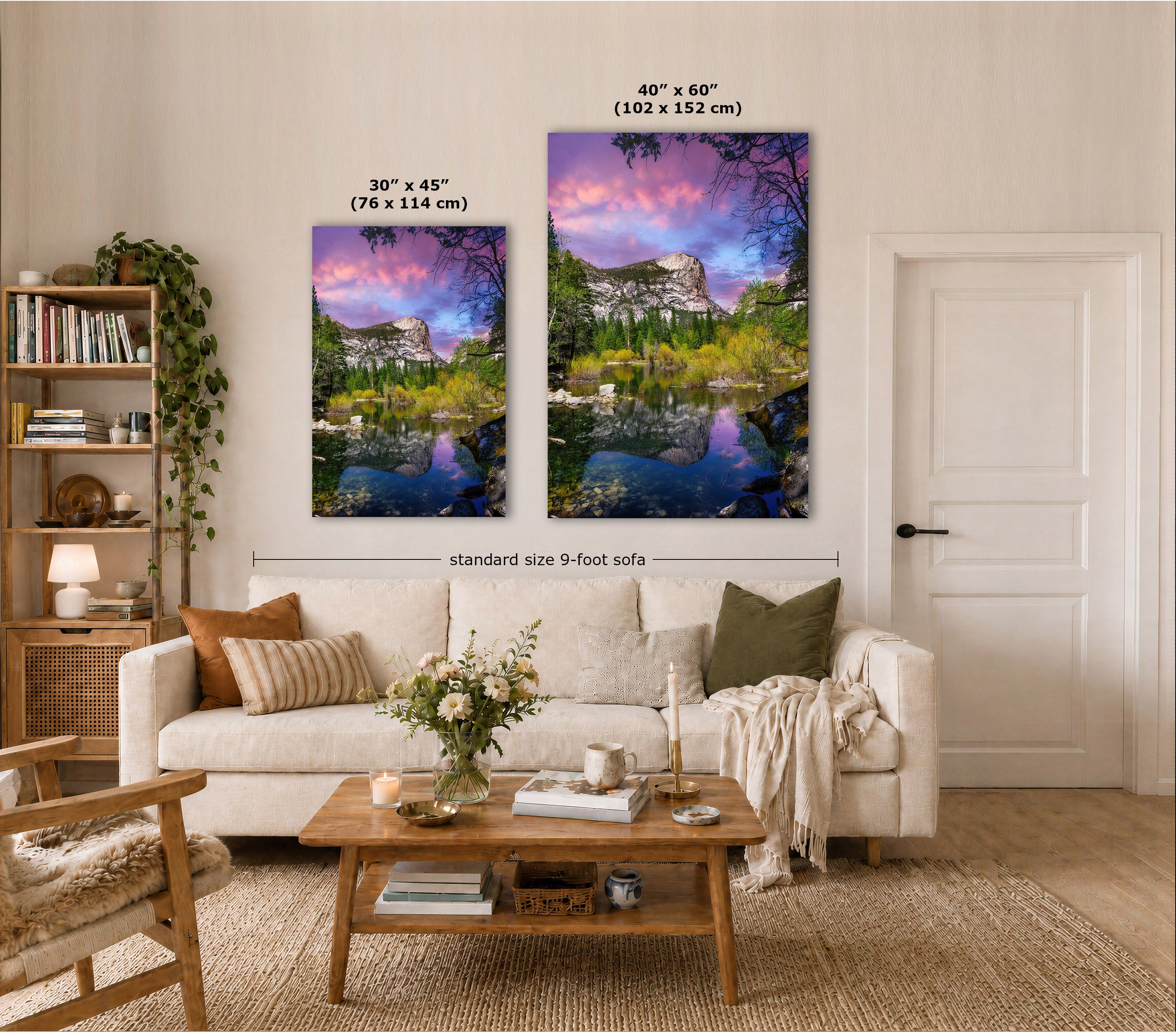 Two vertical wall art prints showing colorful mountain lake landscapes are displayed above a cream sofa in a styled living room. White text labels indicate the sizes 30 x 45 inches and 40 x 60 inches, with a dimension line across the pair reading standard size 9-foot sofa.