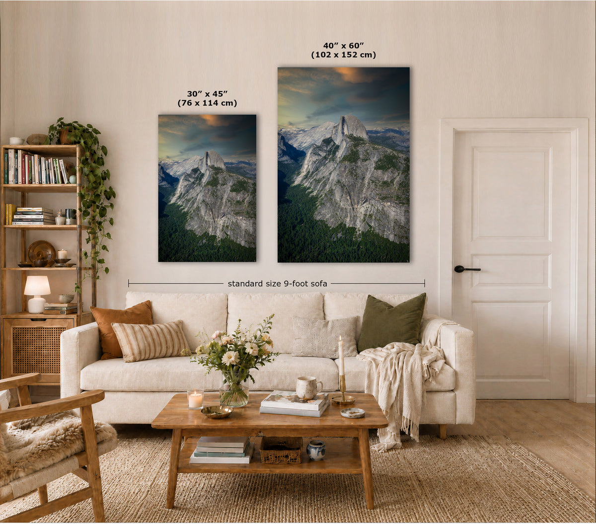 Two vertical canvas prints of mountain scenery displayed above a sofa in a styled living room. The left print is labeled 30" x 45" (76 x 114 cm) and the right print is labeled 40" x 60" (102 x 152 cm), with a dimension line indicating the combined width is standard size 9-foot sofa.