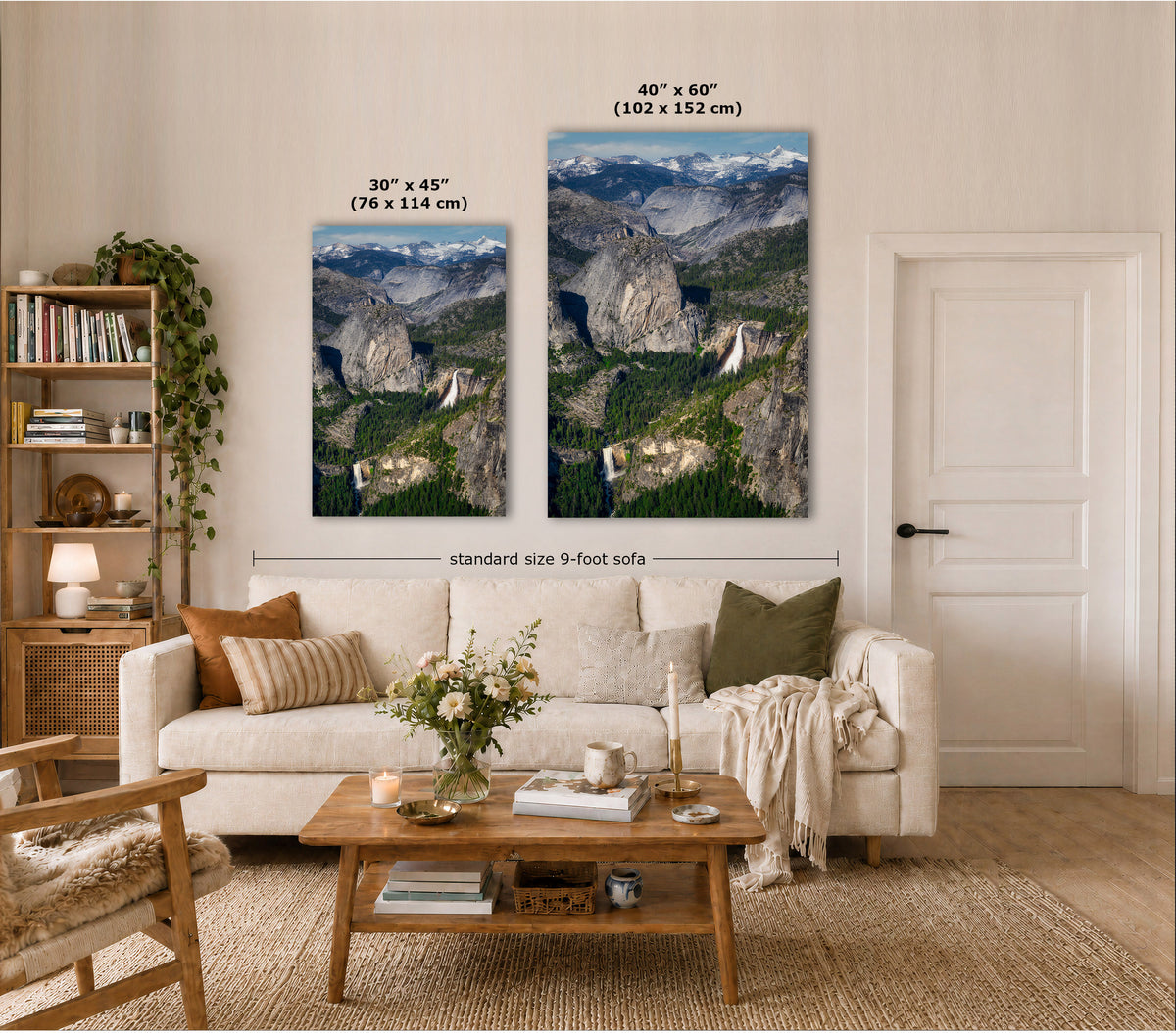 Two vertical canvas prints showing mountain landscape scenery are displayed above a cream sofa in a styled living room. Text labels indicate the sizes 30 x 45 inches and 48 x 60 inches, with a dimension line noting the standard 9-foot sofa width.