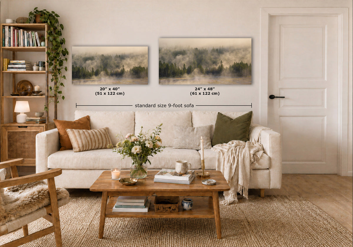 Two framed landscape art prints displayed above a white sofa in a styled living room. The left print is labeled 20" x 40" and the right print 24" x 40", with a dimension line across both indicating standard size 9-foot sofa spacing.