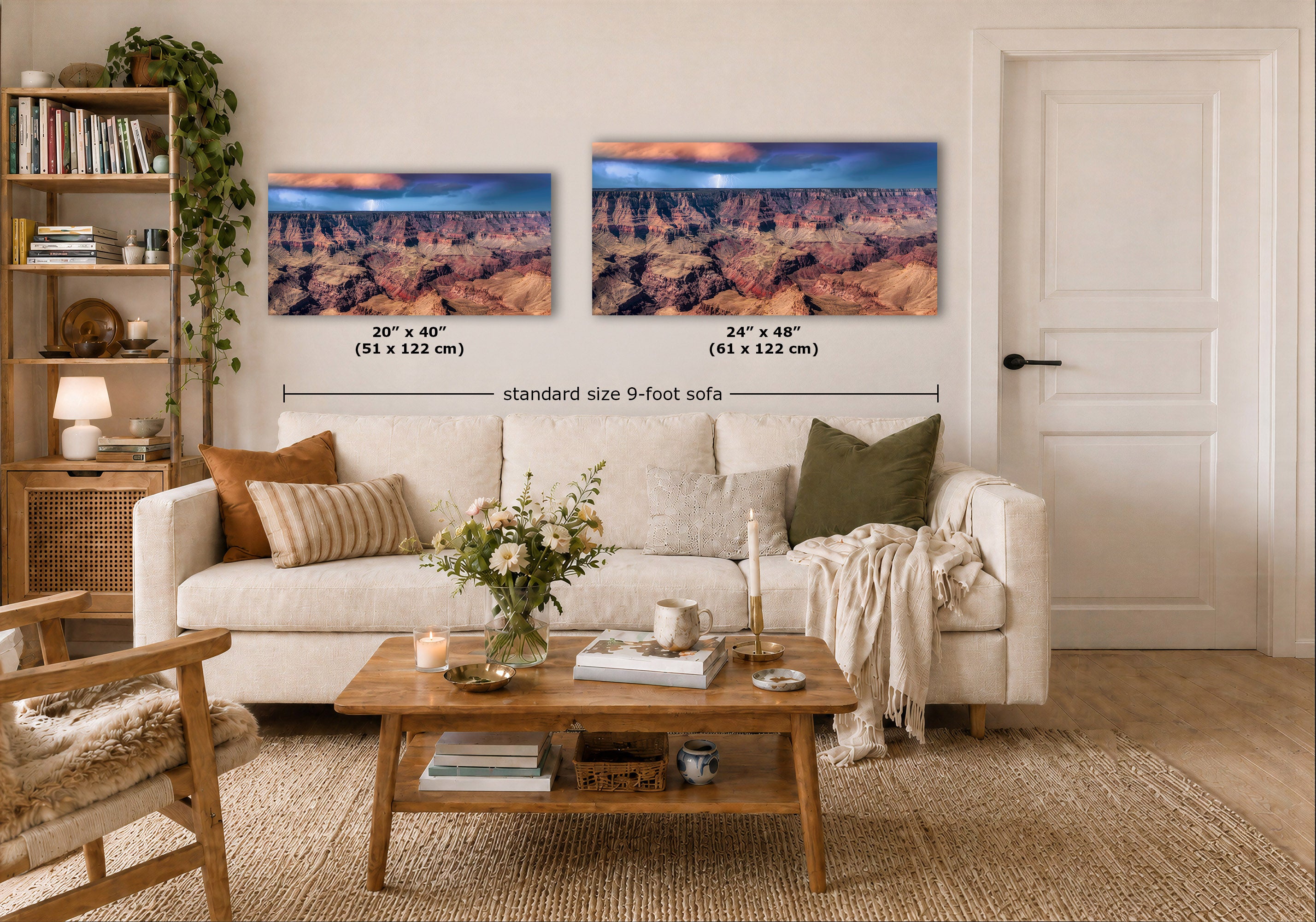 Two wall art prints showing a canyon landscape are displayed above a white sofa in a styled living room. Black dimension lines and text indicate the sizes of both prints as 20" x 40" (51 x 122 cm) and 24" x 48" (61 x 122 cm), with a note reading 'standard size 9-foot sofa'.