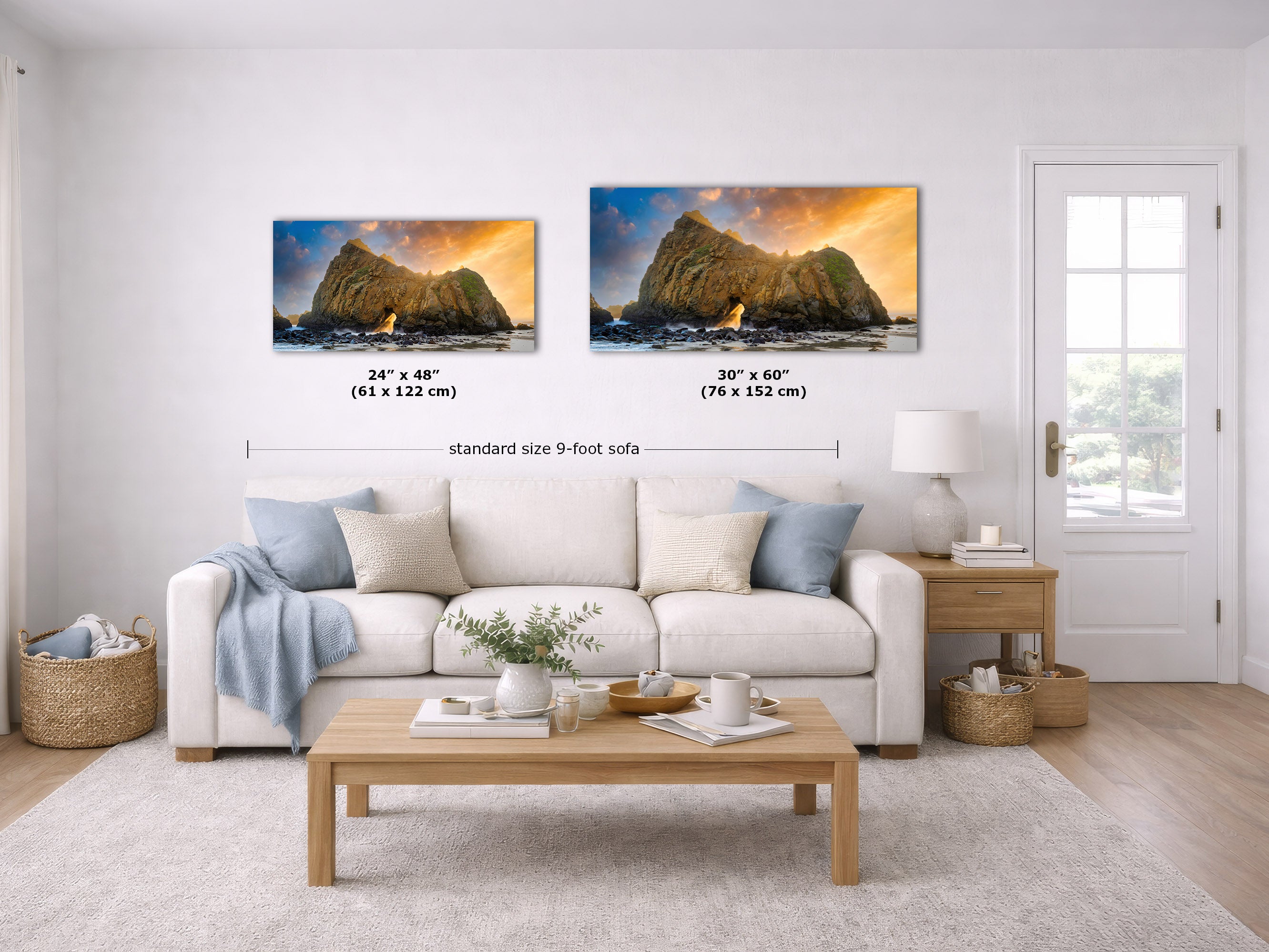 Two framed wall art prints showing rocky cliffs at sunset are displayed above a white sofa in a bright living room. Black measurement lines and text indicate the prints measure 24 x 48 inches and 30 x 60 inches, with 'standard size 9-foot sofa' written below.