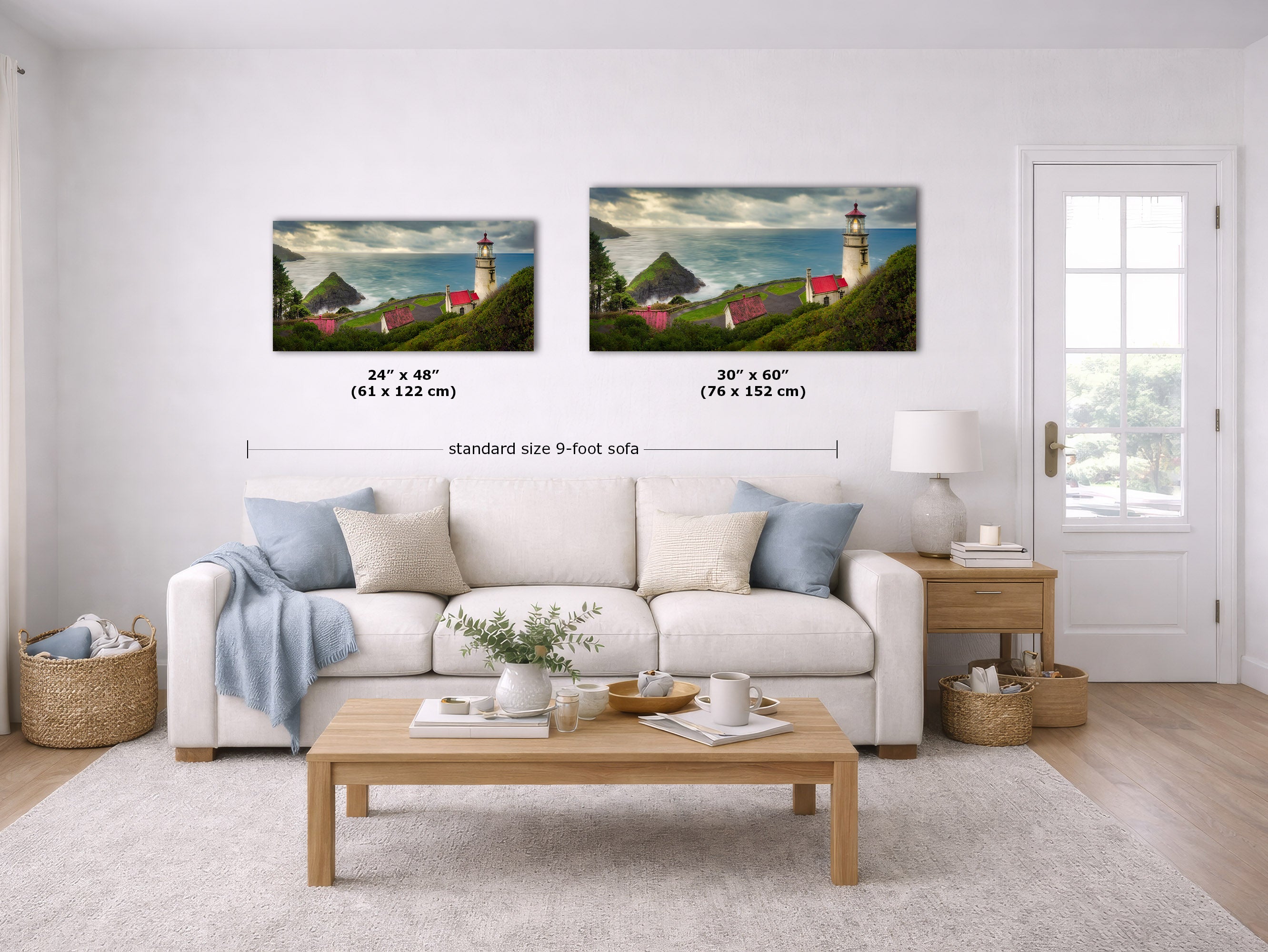 Two framed coastal landscape wall art prints are shown above a white sofa in a bright living room. The left print reads 24 x 48 inches (61 x 122 cm) and the right print reads 30 x 60 inches (76 x 152 cm), with a label below indicating standard size 9-foot sofa spacing.