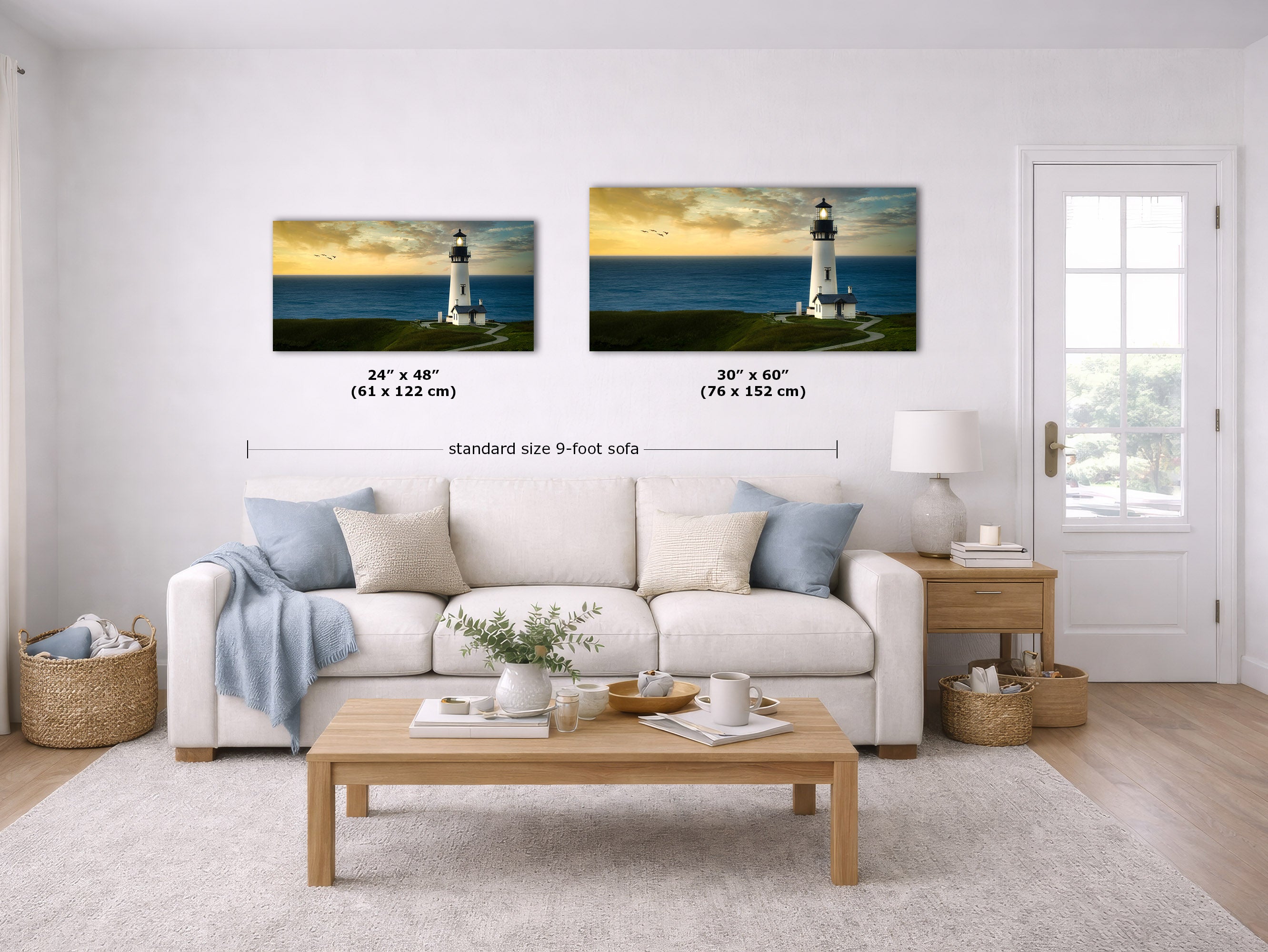 A staged living room shows two framed wall art prints above a white sofa. Each print depicts a lighthouse over ocean water at sunset.