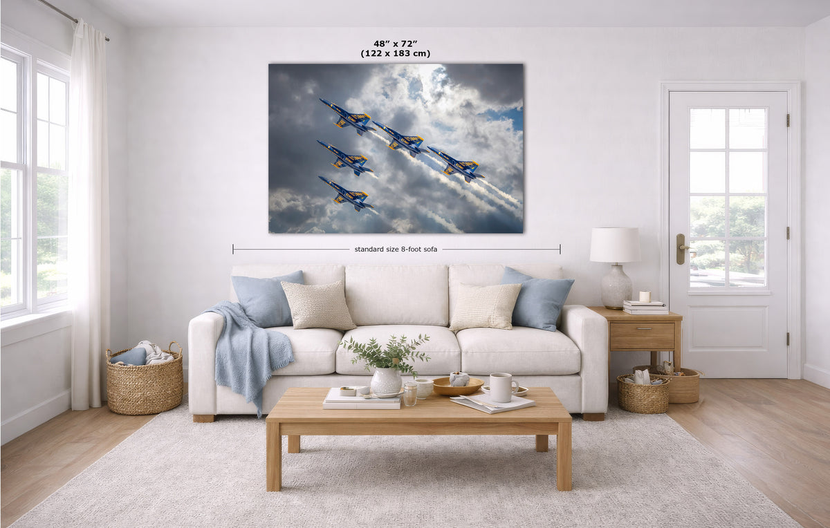 A large rectangular wall art print showing five blue-and-yellow jets flying through clouds, displayed above a white sofa in a bright modern living room. Measurement annotations indicate 48 x 72 inches (122 x 183 cm) and standard size 8 feet side.