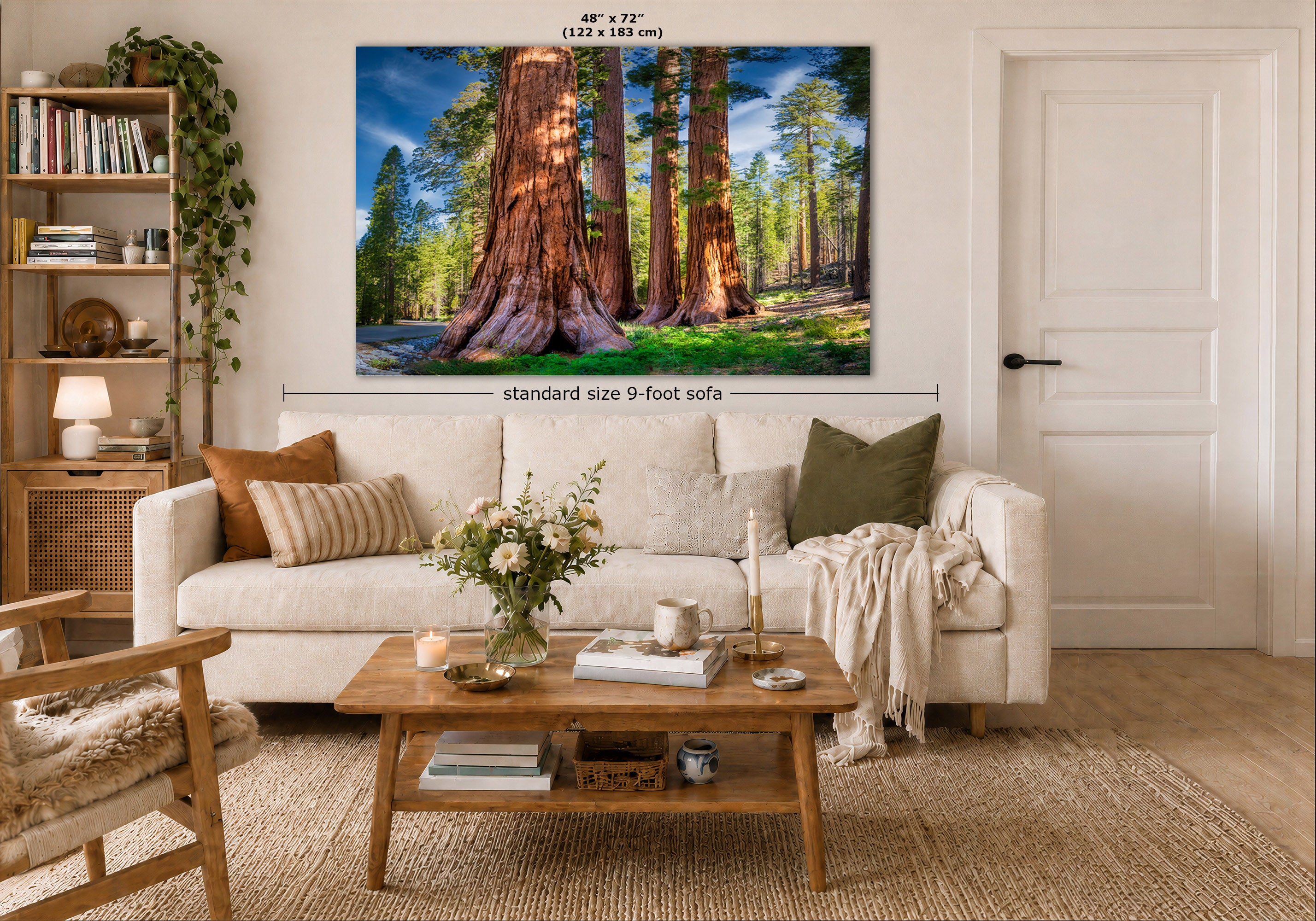 A large wall art print depicting giant redwood trees is displayed above a white sofa in a styled living room. The print includes dimension labels indicating 48 x 72 inches (122 x 183 cm), and the room scene is labeled as a standard size 9-foot sofa scale reference.