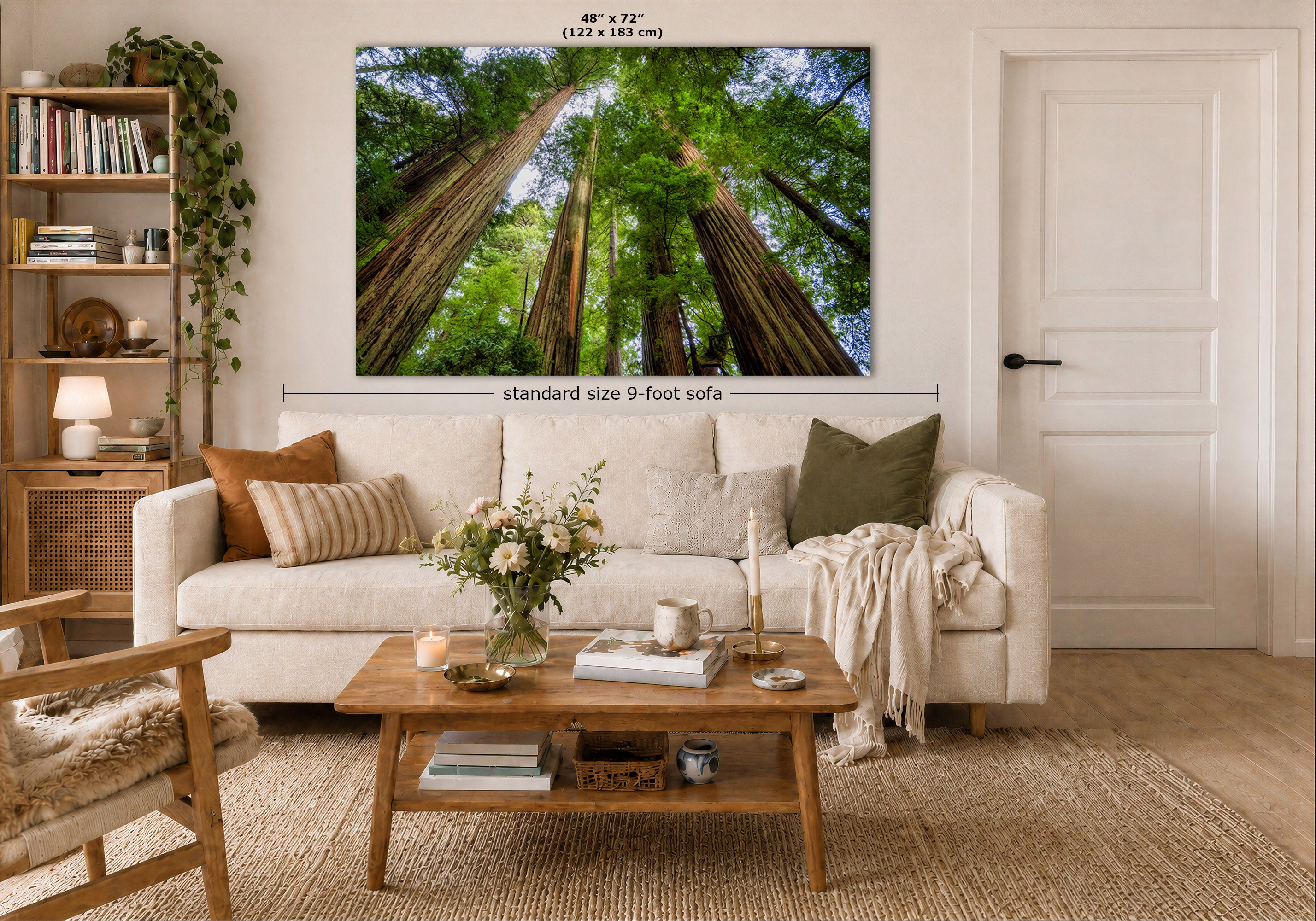 A large wall art print showing a forest of tall redwood trees, displayed above a white sofa in a styled living room. Measurement labels indicate the print is 48 x 72 inches (122 x 183 cm) and the sofa is standard size 9-foot.
