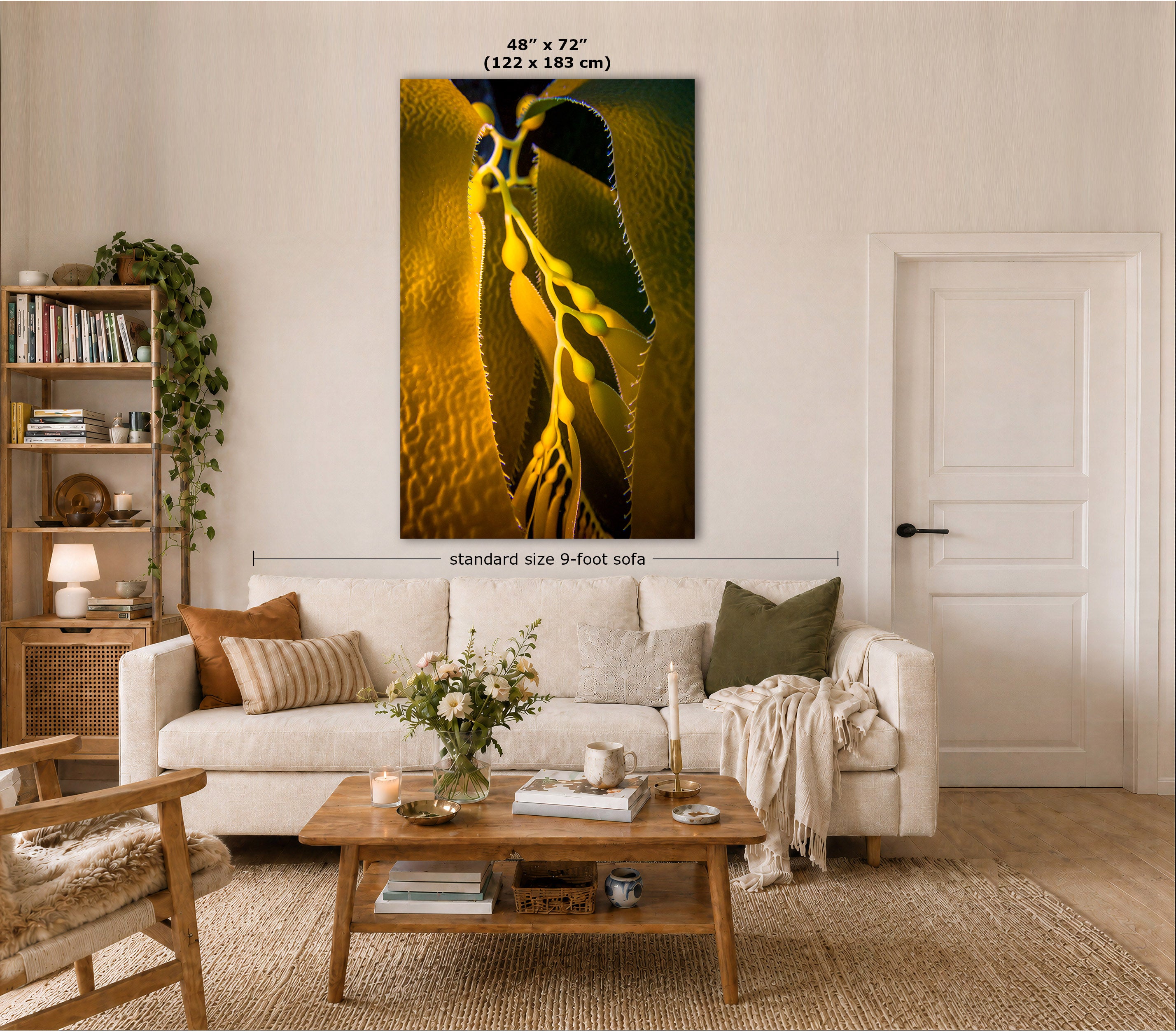 A large vertical wall art print showing a close-up of an underwater kelp scene displayed above a white sofa in a styled living room. The print has dimensions labeled as 48" x 72" (122 x 183 cm), and there is a size marker indicating standard size 9-foot sofa.