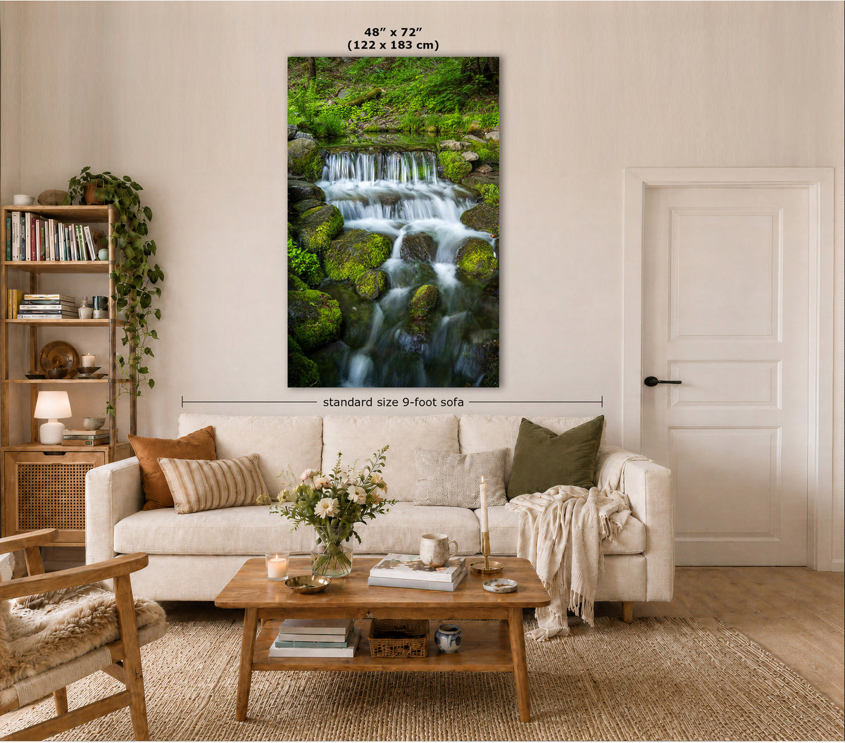 A vertical canvas mossy waterfall wall art print depicting a lush green forest waterfall, styled in a modern living room mockup above a beige sofa. The image includes dimension markings indicating the print is 48" x 72" (122 x 183 cm) and notes a standard 9-foot sofa.