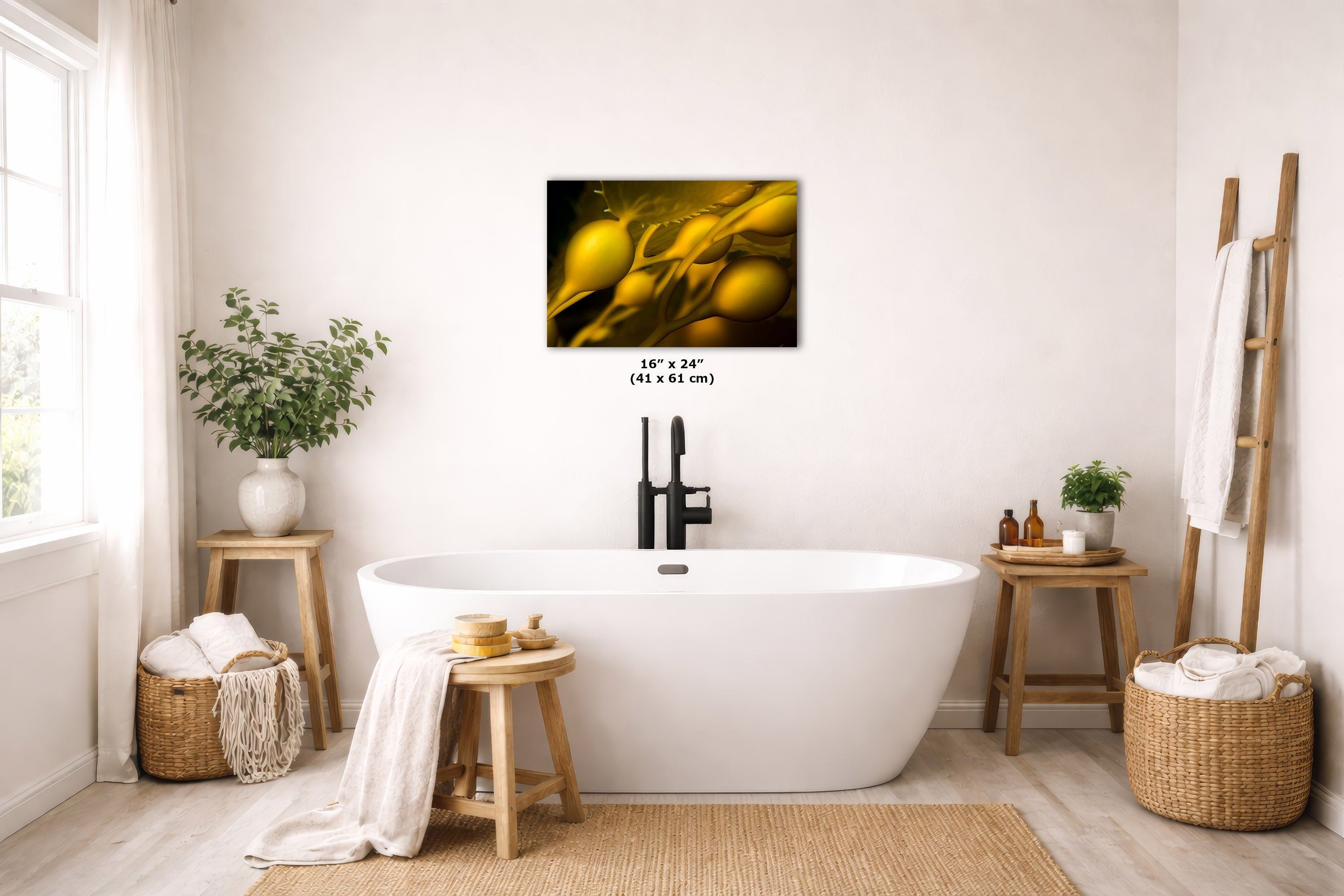 A framed wall art print featuring a close-up of kelp hangs above a freestanding white bathtub in a bright, neutral-toned bathroom. The print is shown as part of a styled interior scene with wooden stools, woven baskets, plants, and a ladder shelf with towels.