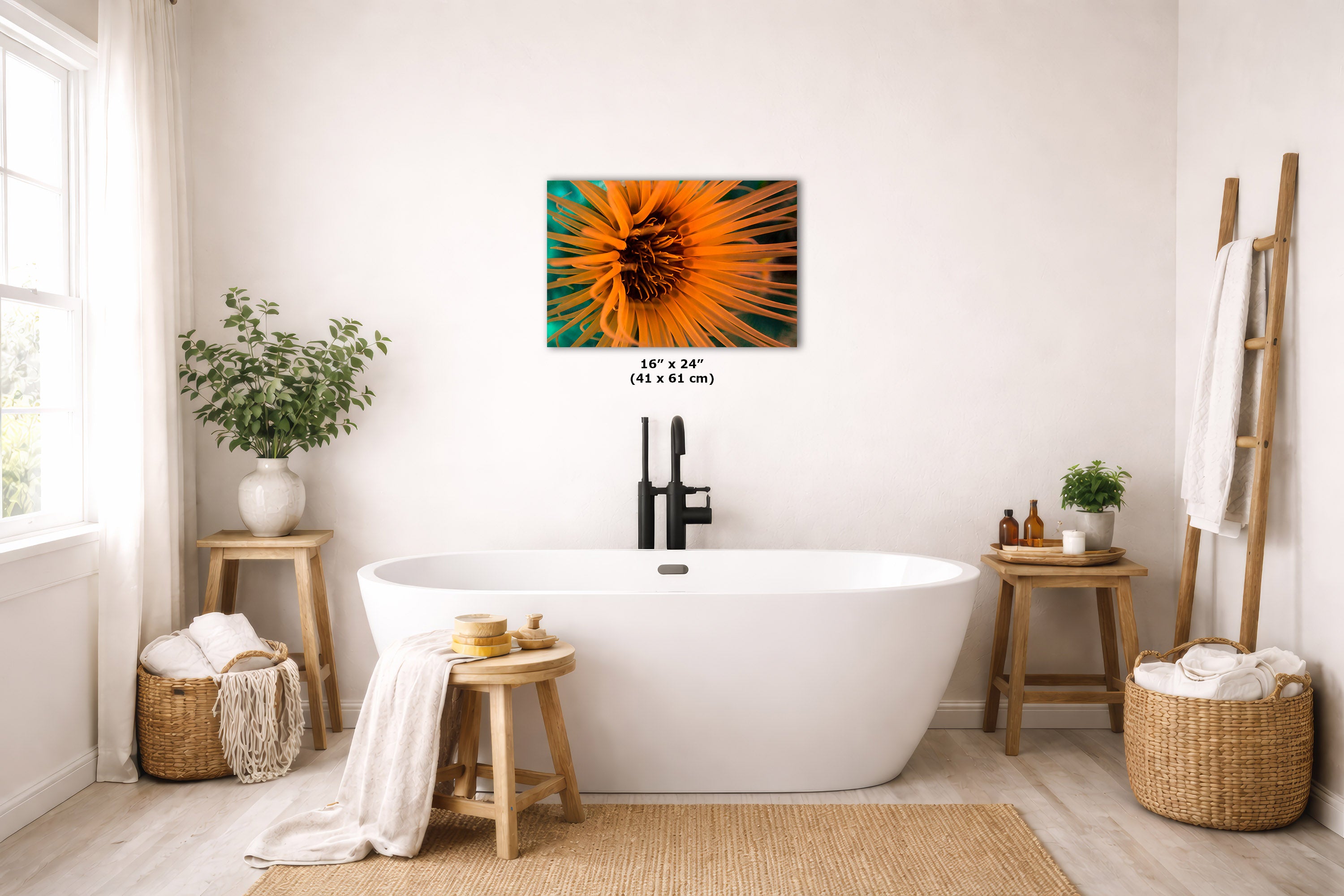 A wall art print featuring a close-up underwater photograph on a teal background, displayed above a white freestanding bathtub in a bright, neutral-toned bathroom with plants, baskets, and wooden stools.