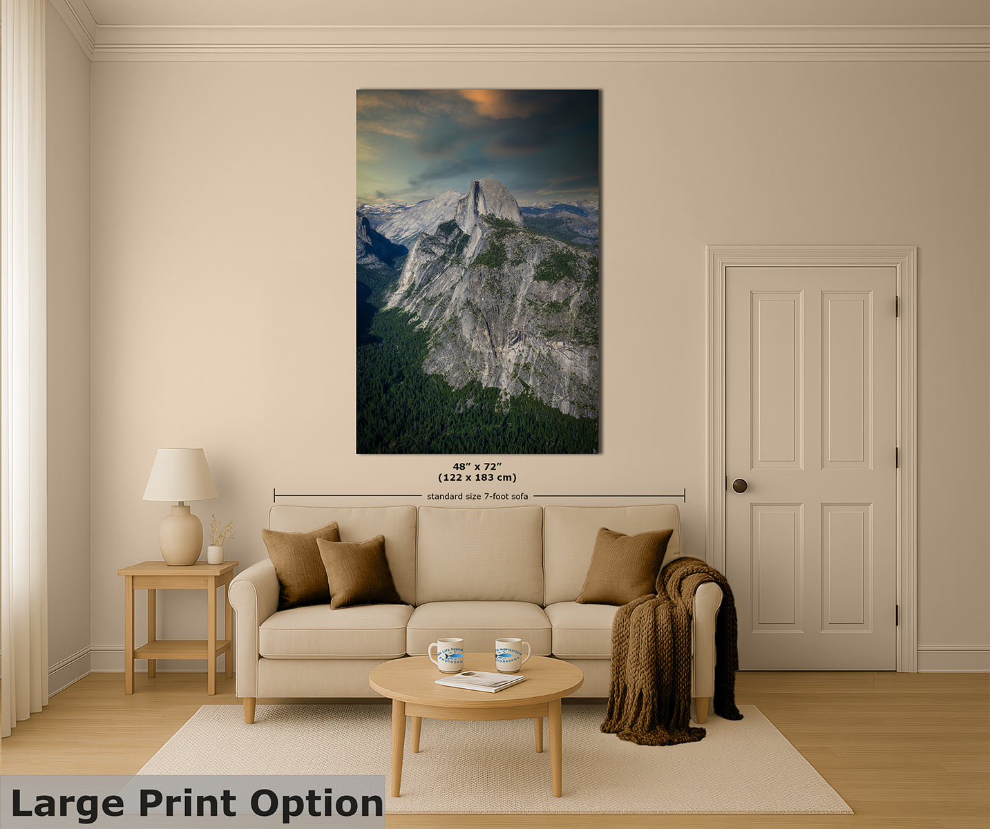 A large vertical wall art print of Half Dome in Yosemite, showing a mountain landscape with a cliff and forest, displayed above a beige sofa in a styled living room. The print includes size text indicating 48 x 72 inches, and the room scene is labeled as a large print option.