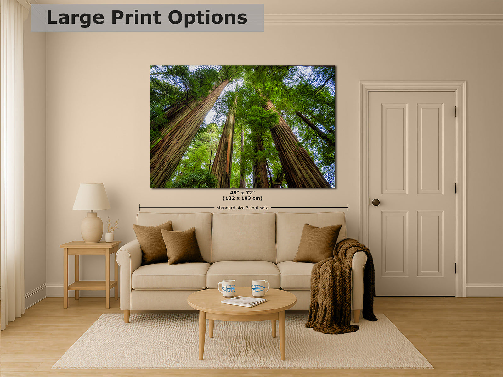 A large wall art print showing a forest of tall redwood trees, displayed above a beige sofa in a styled living room. The image includes text overlays indicating 'Large Print Options' and dimensions '60 x 72 (122 x 183 m)'.