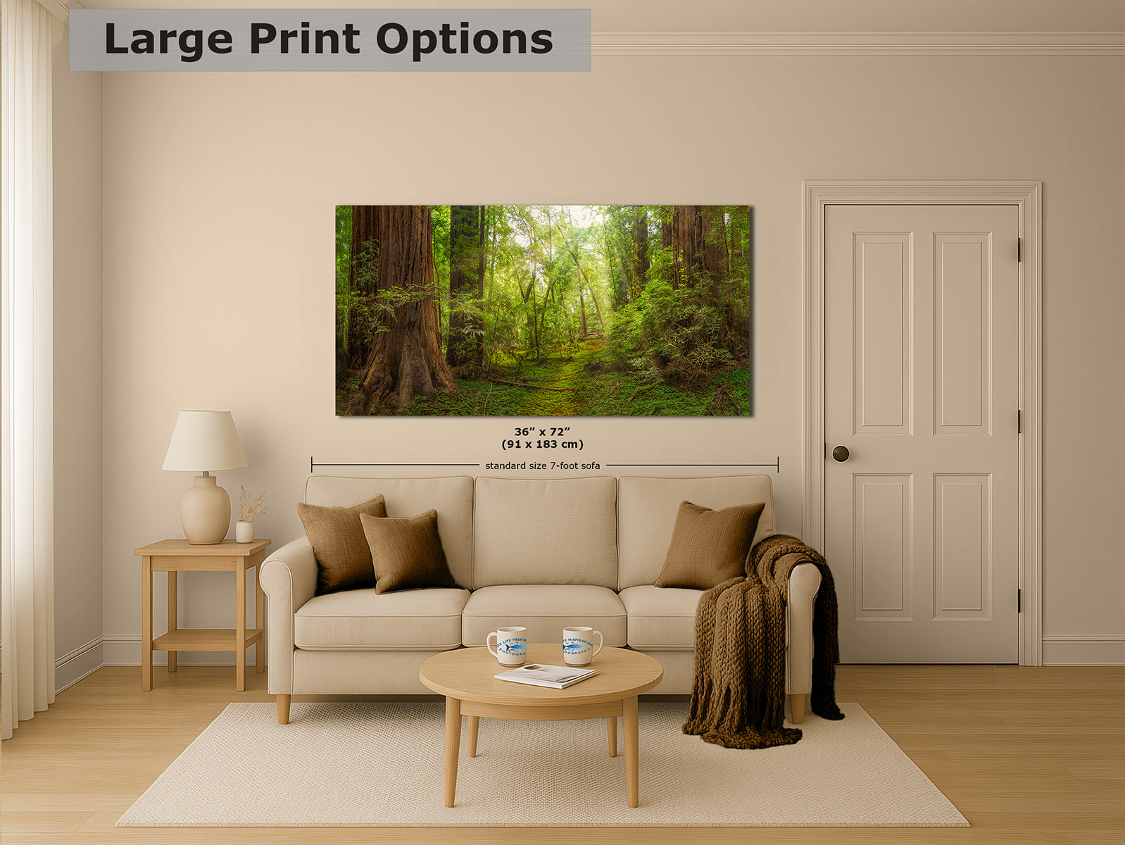 A large wall art print showing a Redwood forest path with tall trees and green foliage, displayed above a beige sofa in a styled living room. The image includes the text 'Large Print Options' at the top and size information '36" x 72"' centered below the artwork.