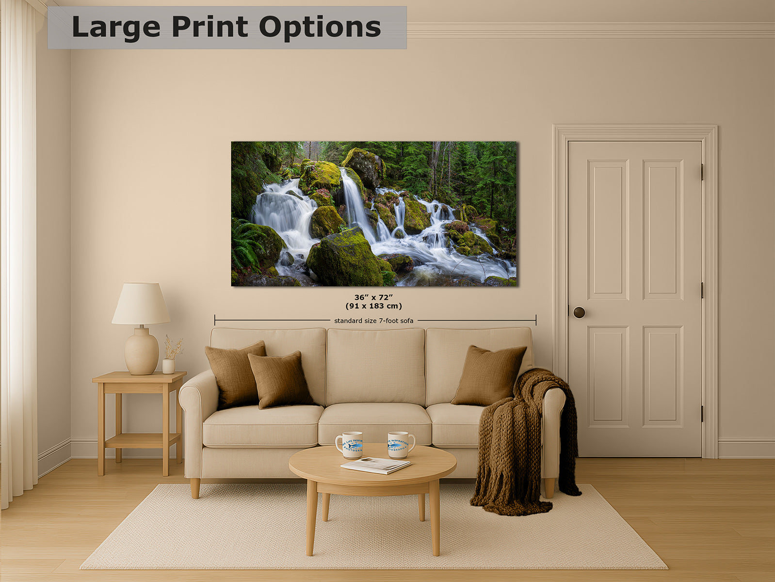 A framed wall art print showing a waterfall in a lush green forest, displayed above a beige sofa in a styled living room. The image includes a text overlay at the top reading 'Large Print Options' and size information below the artwork.