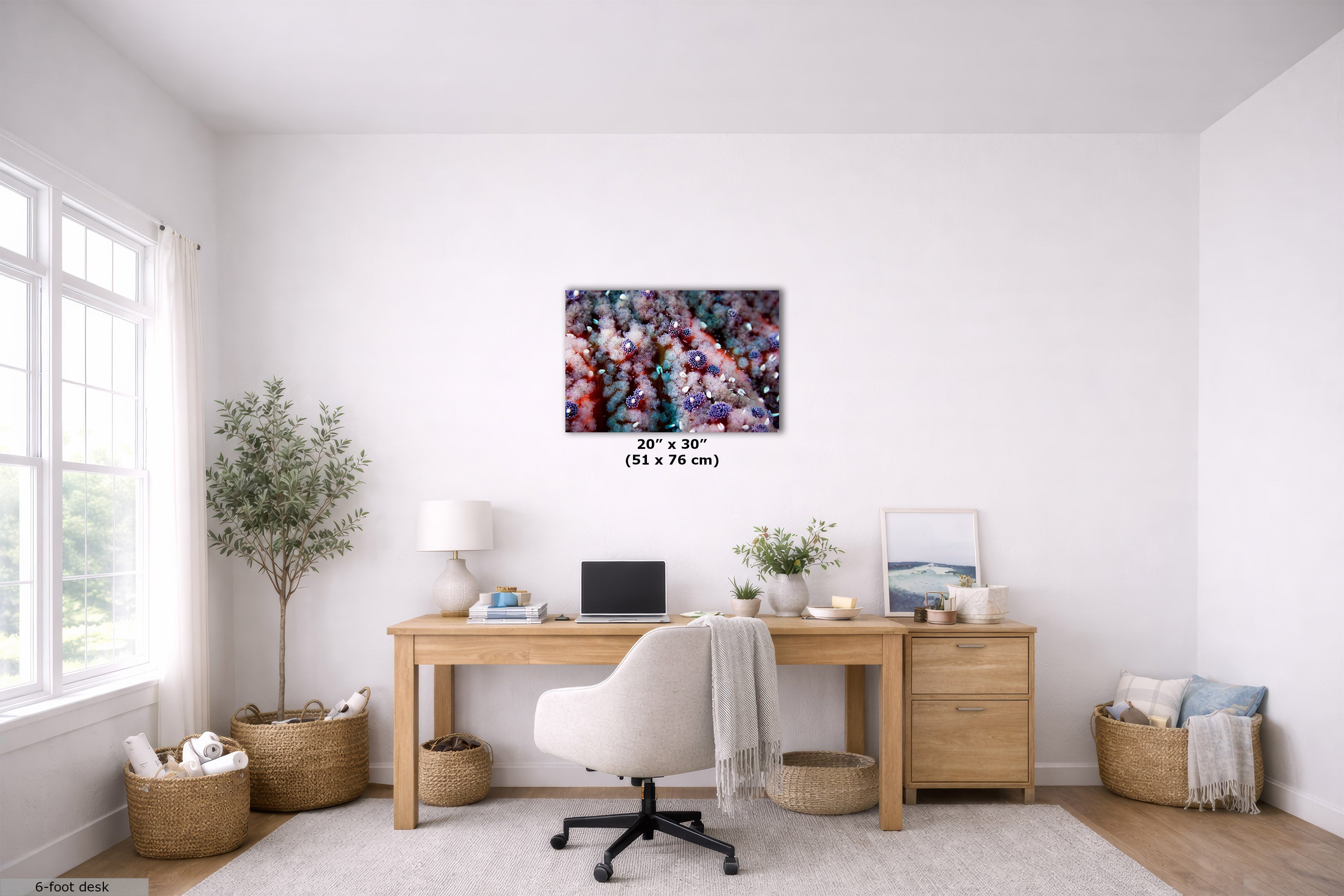 A colorful abstract canvas wall art print displayed in a bright, modern home office setting above a wooden desk with a white office chair.