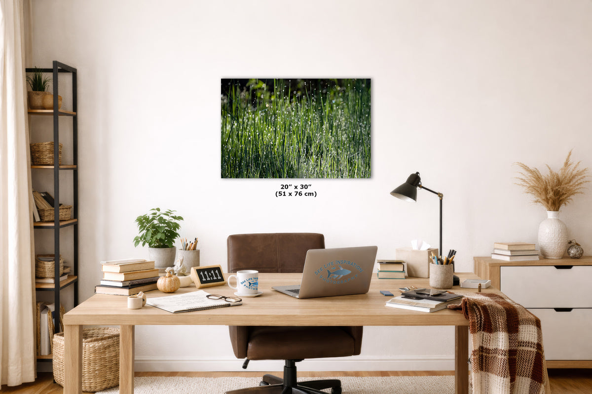 A rectangular wall art print showing a green and dark forest-like scene hangs above a wooden desk in a styled home office. The print includes size text reading 20 x 30 (51 x 76 in).