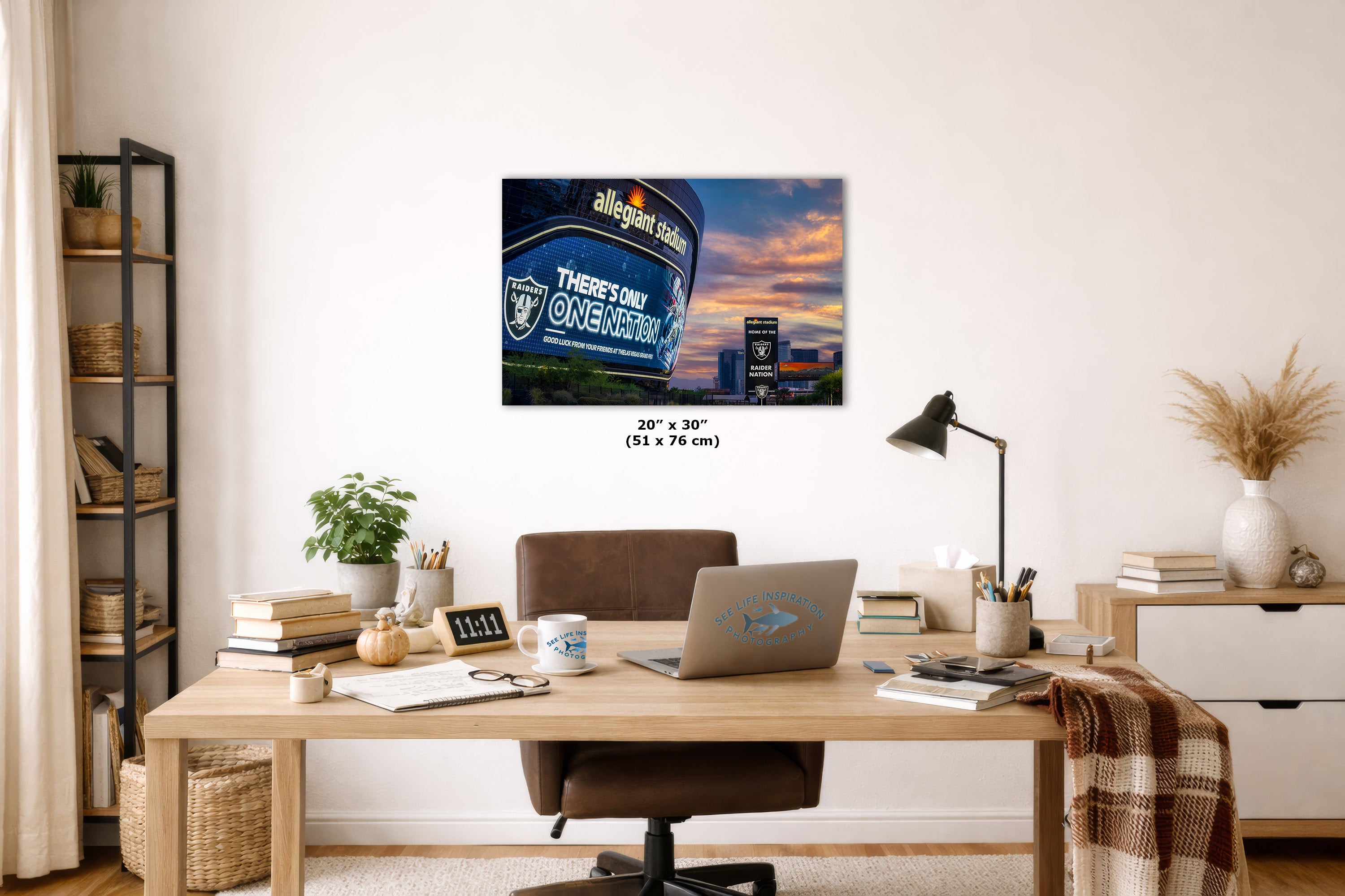 A wall art print, displayed in a modern, well-lit home office setting above a wooden desk.