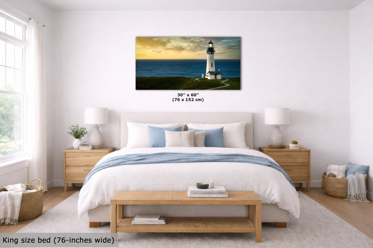 A framed wall art print showing a lighthouse over ocean water hangs above a bed in a bright, modern bedroom. The print is labeled 30" x 60" (76 x 152 cm), and the room includes a king-size bed, wooden nightstands, lamps, and a bench.