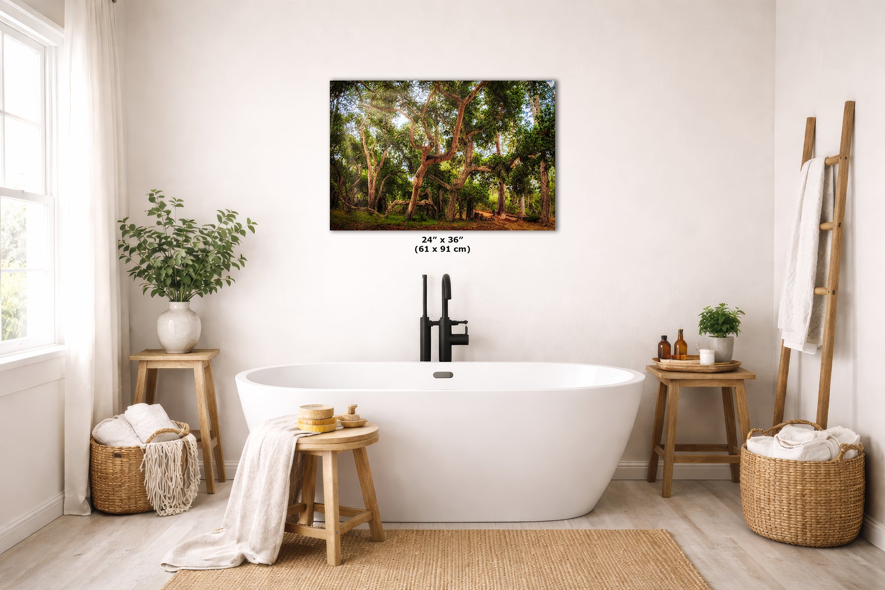 A coast live oak forest landscape art print is displayed on a white wall above a freestanding bathtub in a bright, modern bathroom. The print shows a lush green woodland scene with trees and sunlight filtering through the leaves.