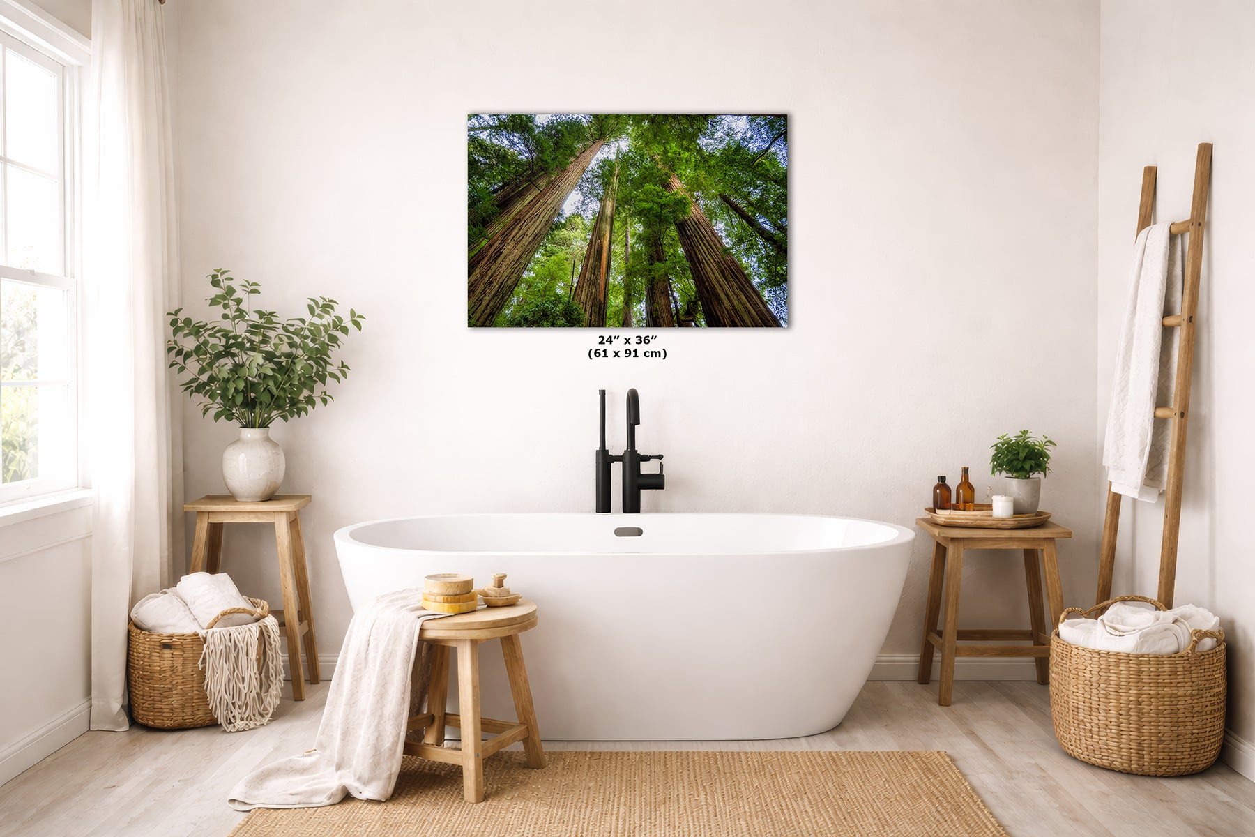 A wall art print depicting a forest of giant redwood trees, displayed in a bright, modern bathroom above a white freestanding bathtub.