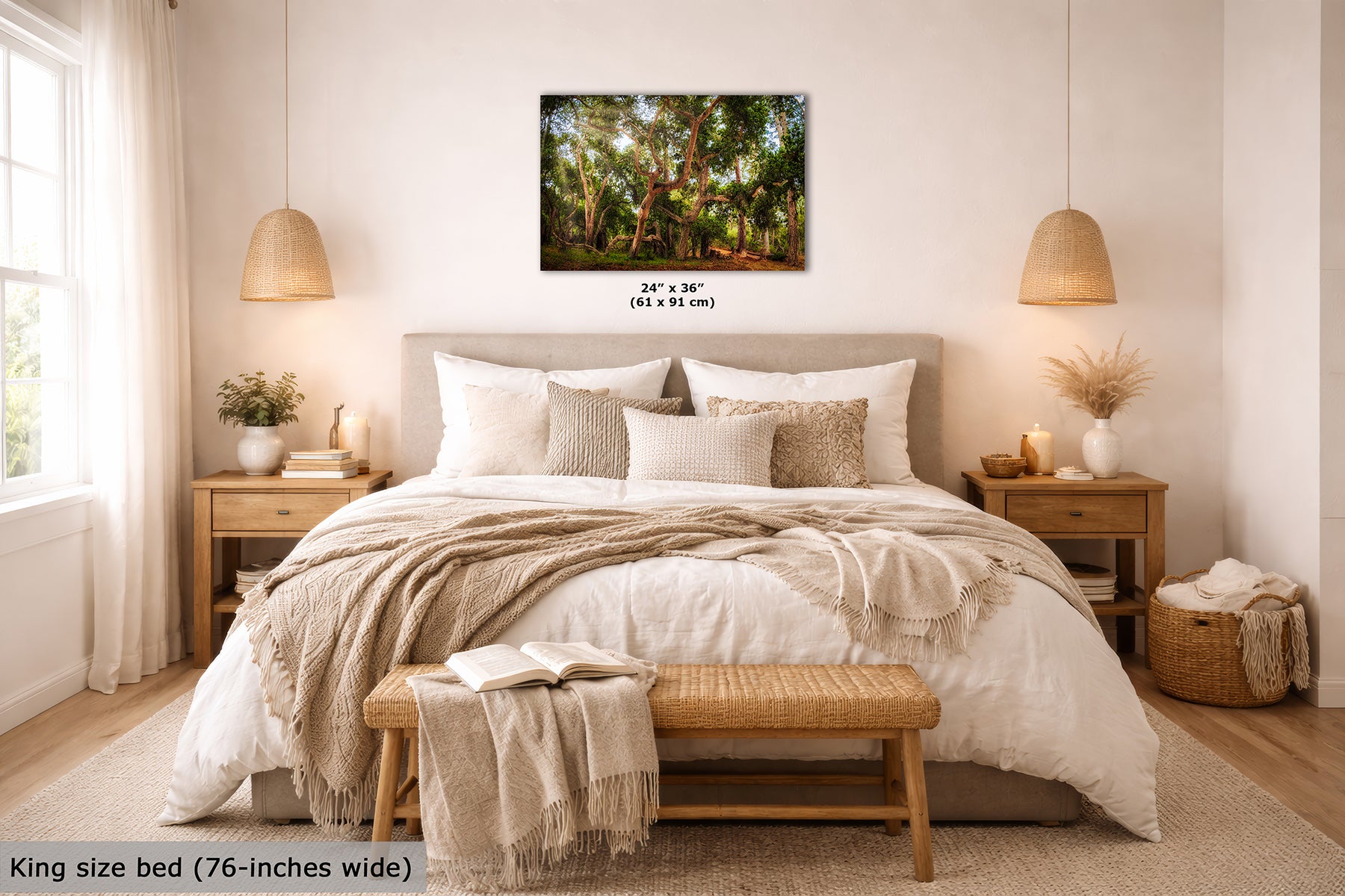 A coast live oak forest landscape wall art print is displayed above a neatly made bed in a bright, modern bedroom. The print shows dense green trees with warm sunlight filtering through the leaves.