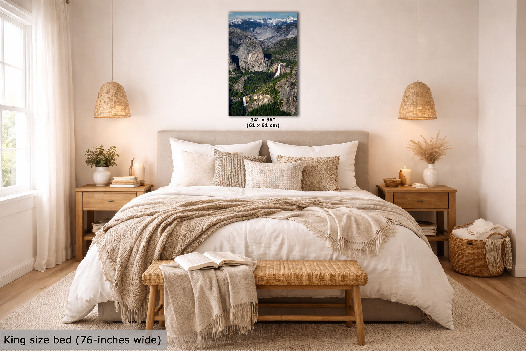 A Yosemite wall art print showing a mountain landscape with Nevada and Vernal Falls, displayed above a neatly made bed in a bright, modern bedroom. The print includes size text reading 24" x 30" (61 x 91 cm).