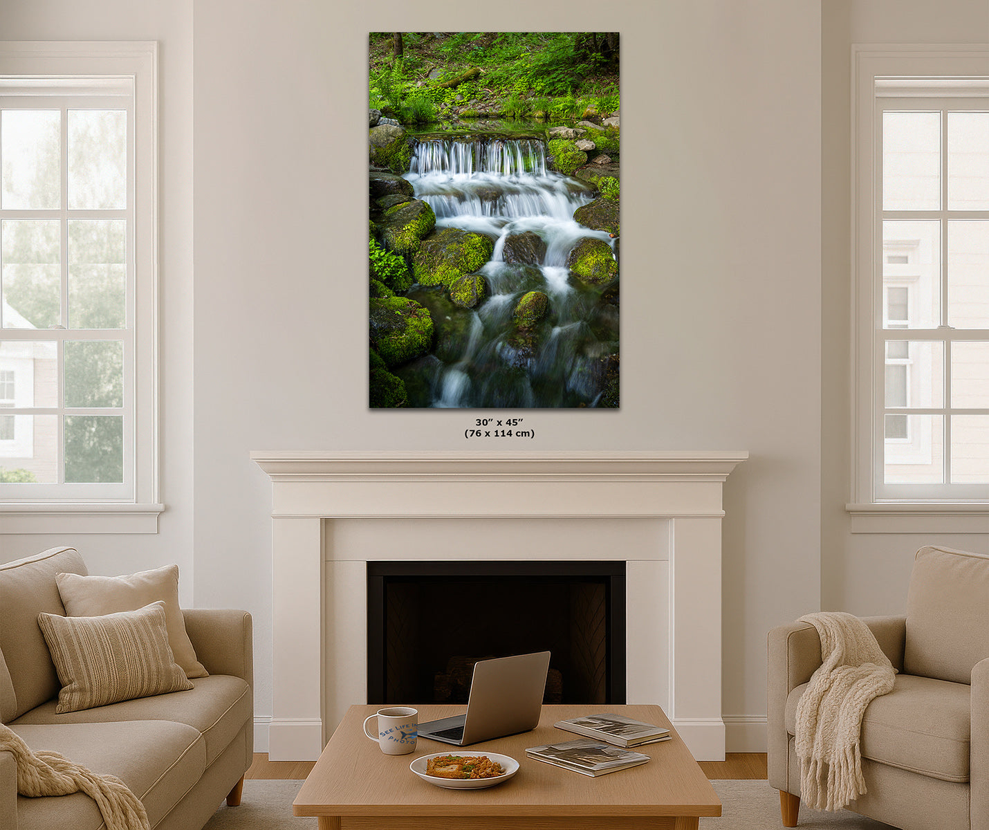 A vertical wall art print depicting a lush green forest waterfall, styled in a living room mockup above a white fireplace mantel.