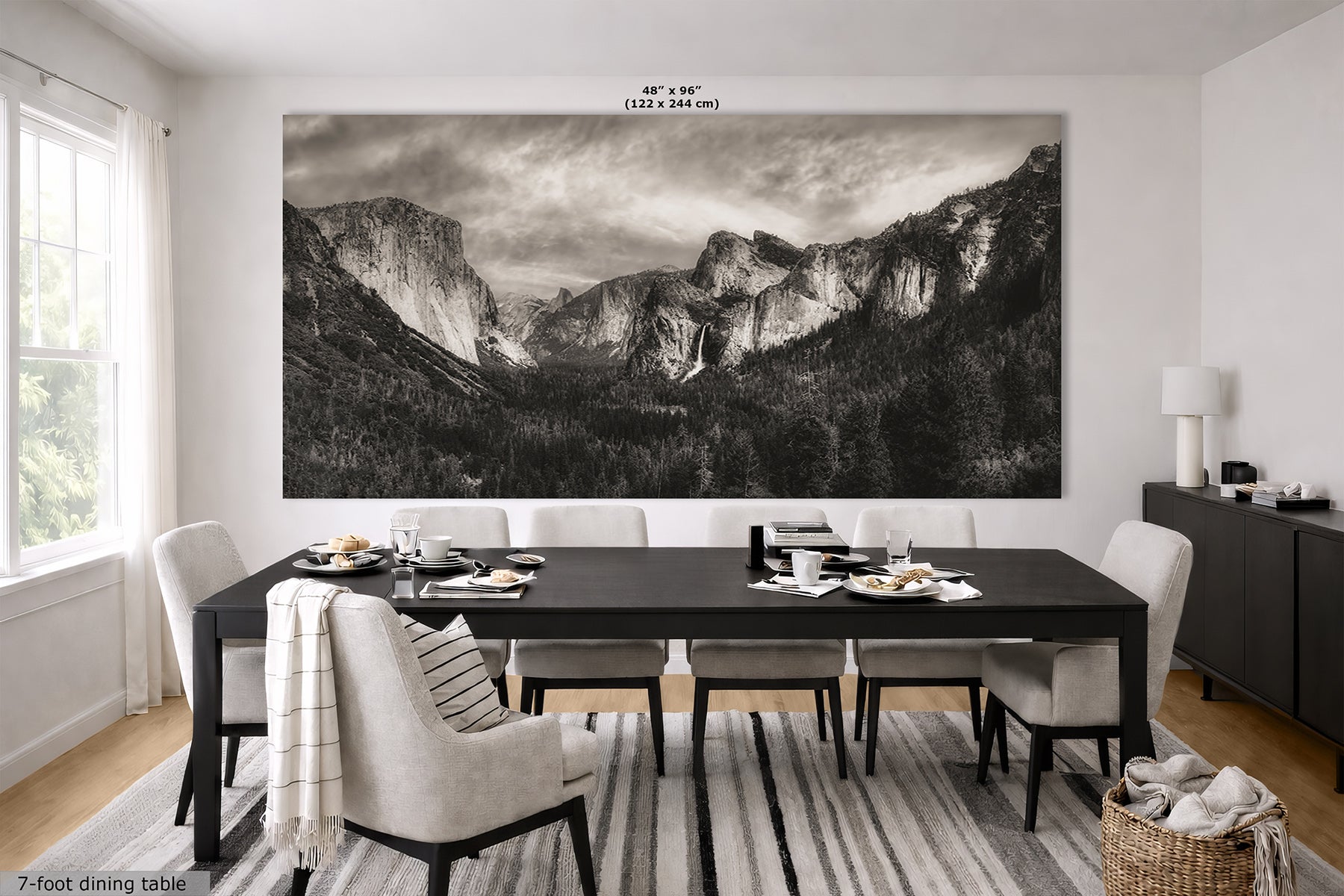 A large black-and-white wall art print home decor showing Yosemite Valley from Tunnel View, displayed above a dining table in a modern dining room. The print includes size text at the top and a 7-foot dining table label at the bottom left.
