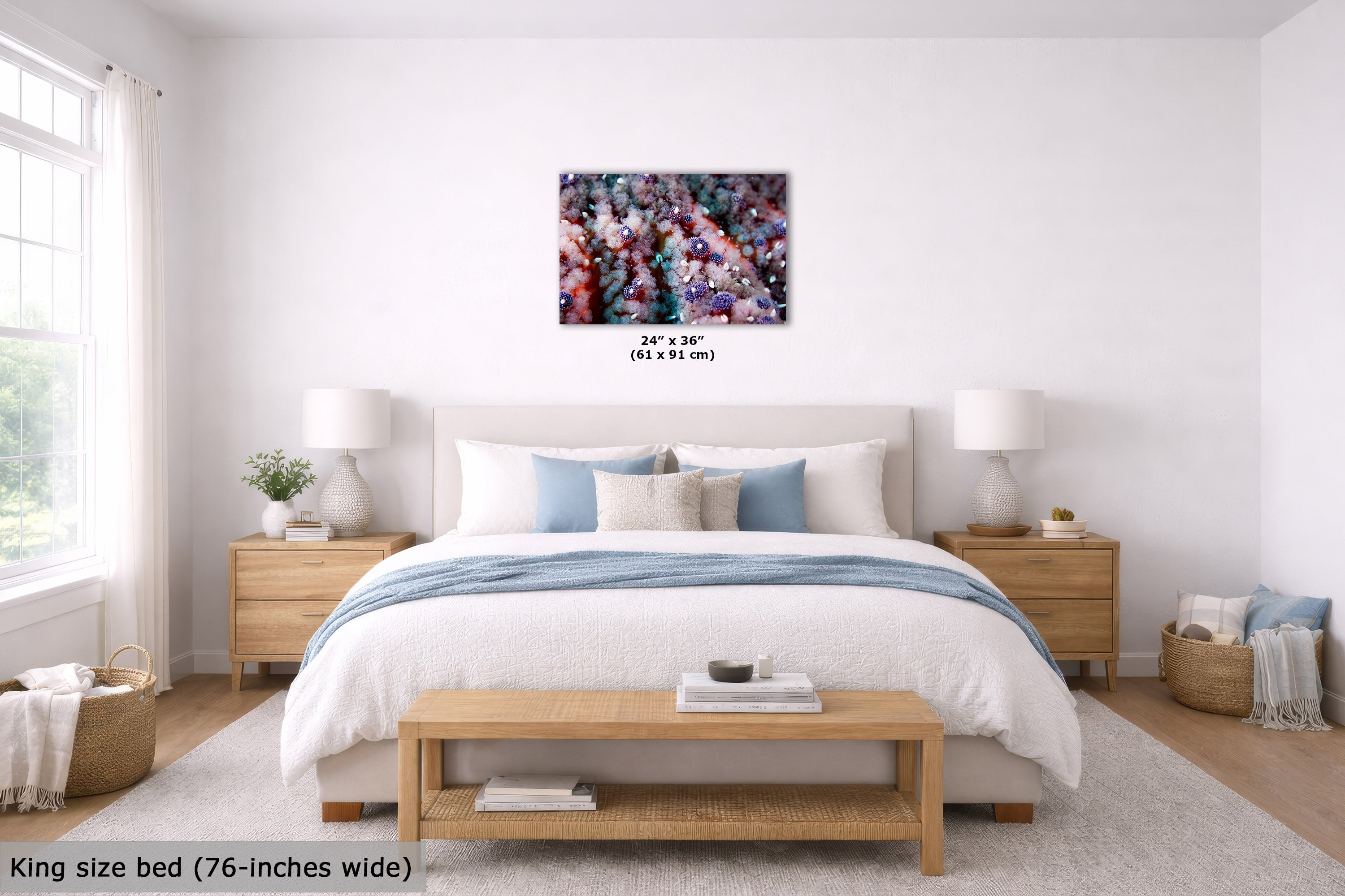 A bedroom scene showing an abstract wall art print above a neatly made bed. The artwork features a dense, colorful abstract starfish pattern in pink, purple, blue, green, and yellow tones.