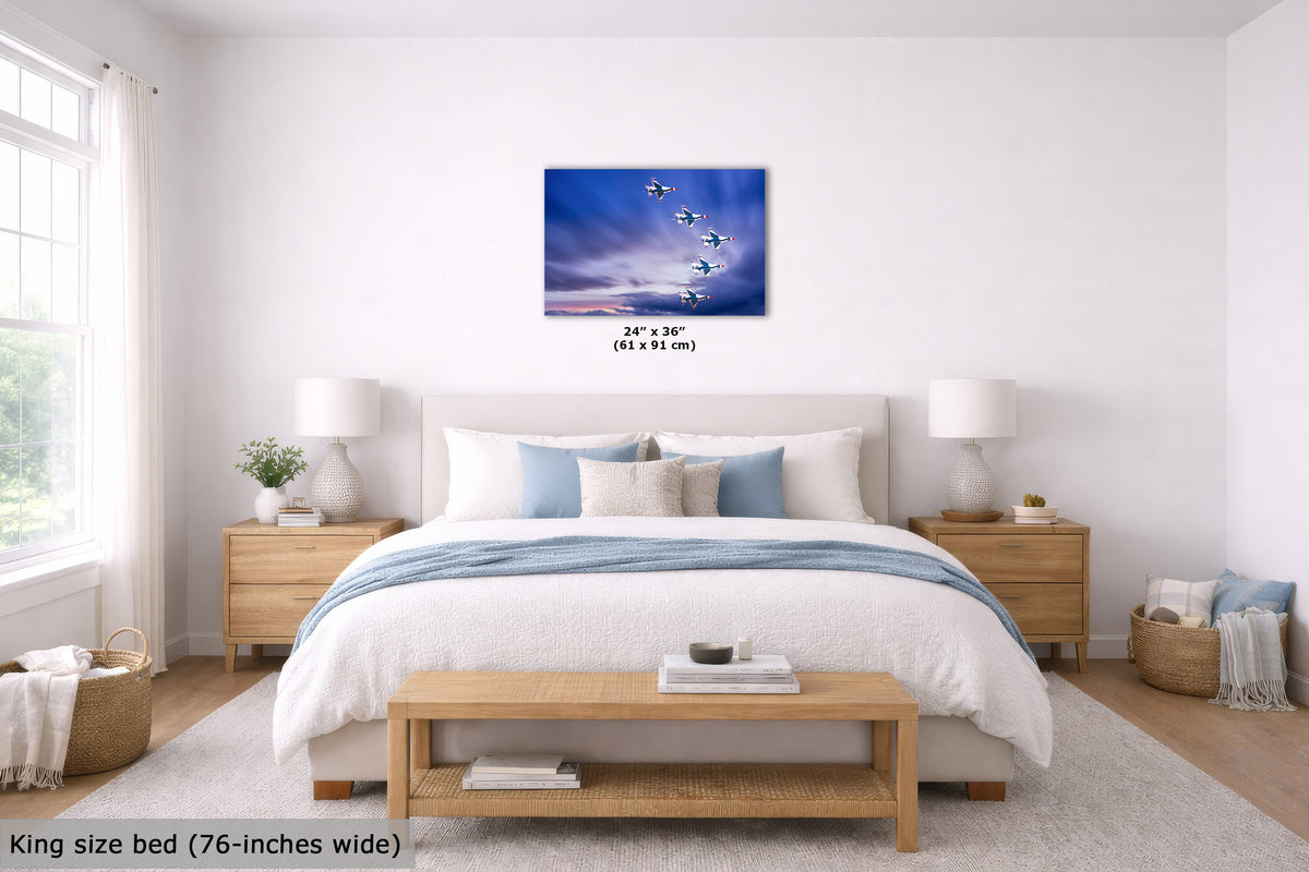 A bedroom scene showing a wall art print above a bed. The artwork depicts a blue sky with white birds, and the image includes size text reading 24" x 36" (61 x 91 cm) and a note at bottom left saying King size bed (76-inches wide).