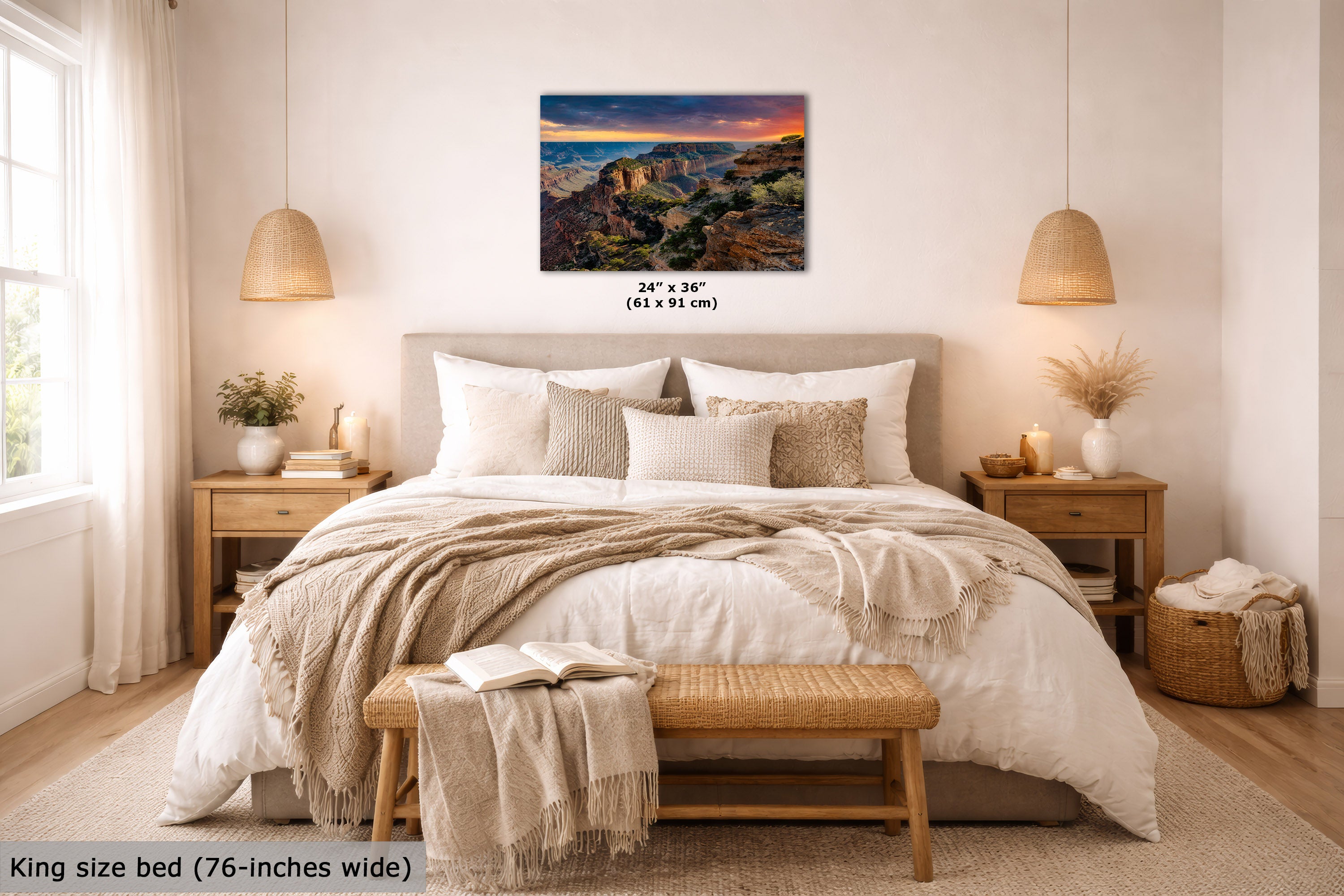 A landscape wall art print showing a canyon at sunset hangs above a neatly made bed in a bright, modern bedroom. The print includes size text reading 24 x 36 inches (61 x 91 cm), and the room scene also includes a text label at the bottom left stating king size bed (76-inches wide).