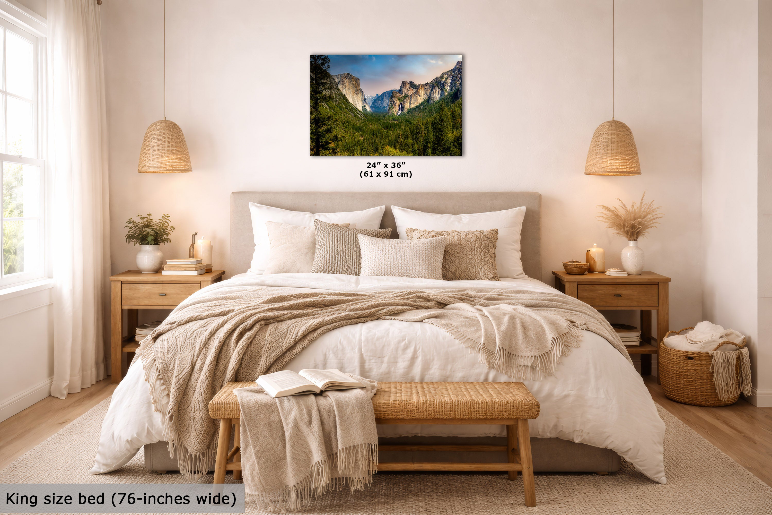 A wall art print showing a mountain landscape with green forest below, displayed above a neatly made bed in a bright, modern bedroom. The print includes size text reading 24 x 36 inches (61 x 91 cm), and the room scene also includes a bed, nightstands, lamps, and decorative textiles.