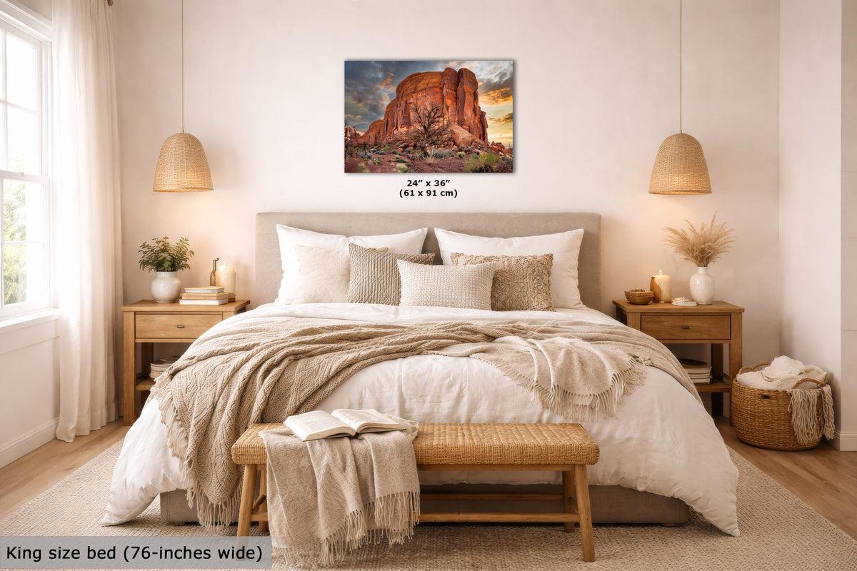 Bedroom with a King size bed, wooden nightstands, and a decorative wall art piece.