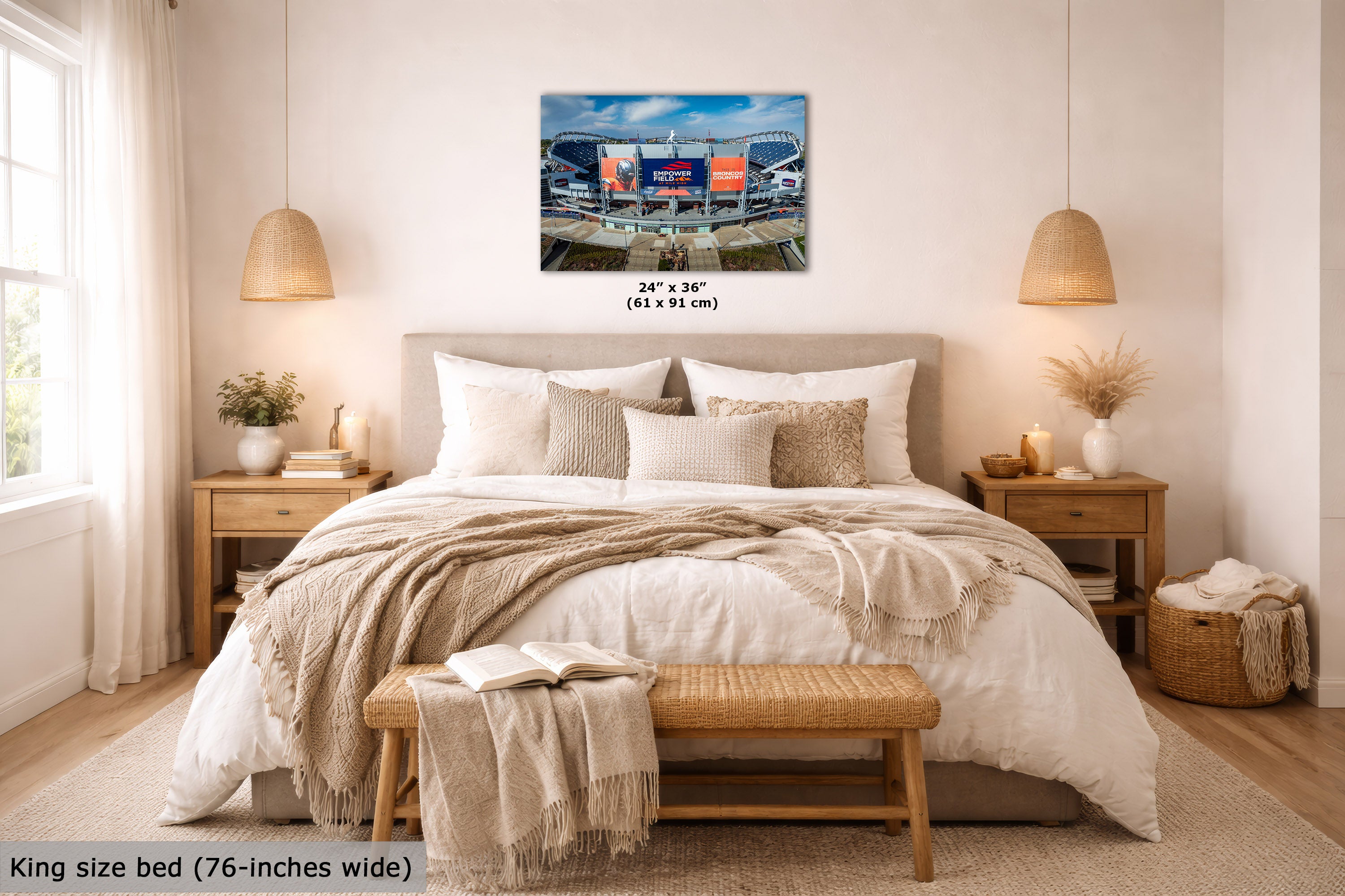 A wall art print showing a football stadium scene, displayed above a neatly made bed in a bright, modern bedroom. The print includes size text indicating 24 x 36 inches (61 x 91 cm), and the room scene includes a text overlay noting the king size bed is 76 inches wide.