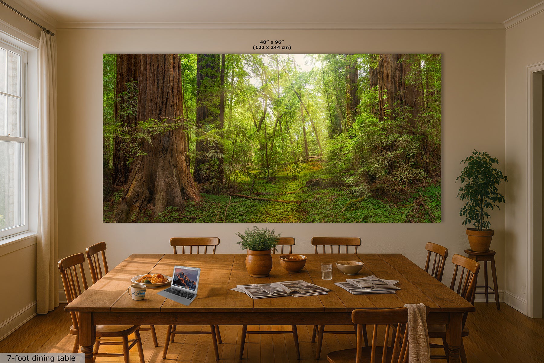 A large wall mural or canvas print depicting a lush green Redwood forest path with tall trees, displayed on a dining room wall above a wooden table and chairs.
