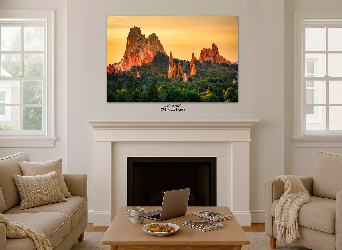 A wall art print showing a desert rock landscape at sunset hangs above a white fireplace in a bright living room. The print is labeled 30 x 45 inches (76 x 114 cm) below it.