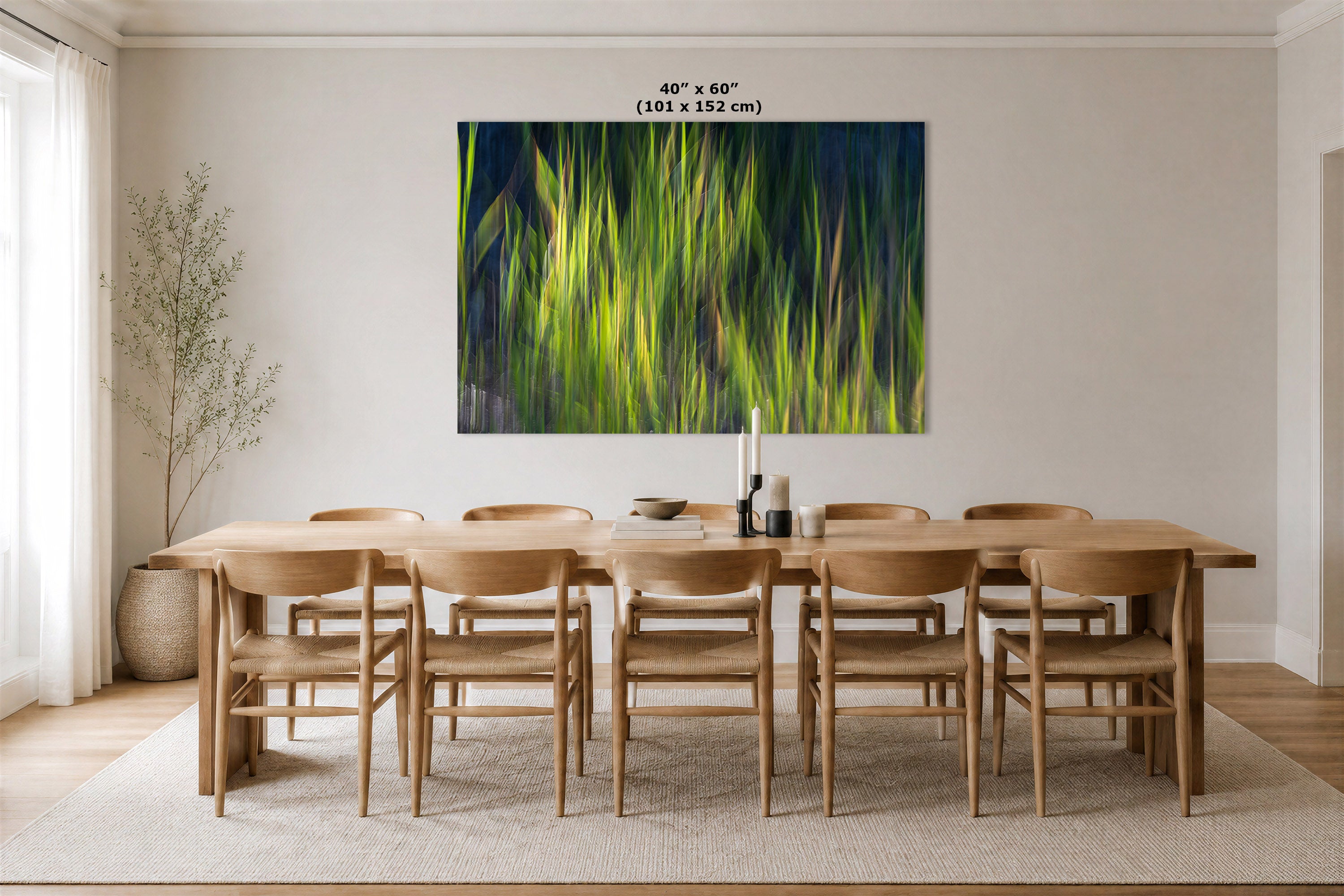 A large abstract wall art print featuring vibrant green and yellow brushstrokes on a dark blue background, displayed in a dining room above a wooden dining table and chairs. The print has a size label at the top reading 46" x 60" (101 x 152 cm).