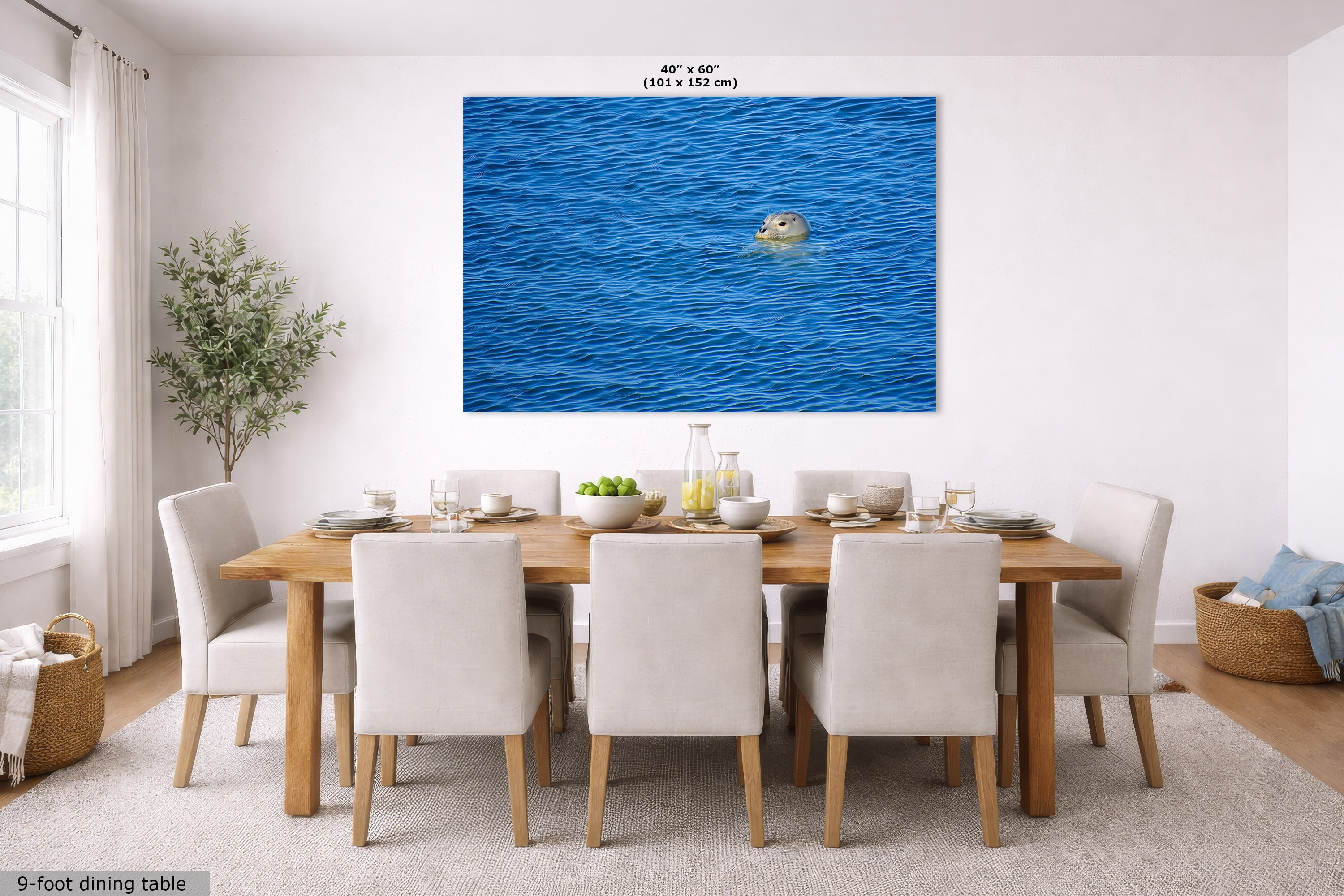 A large rectangular wall art print displayed above a wooden dining table with white chairs in a bright modern dining room. Small text at the top of the print reads 40" x 60".