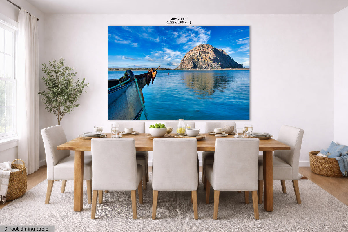 Dining room with a large wall-mounted canvas of a boat and mountain scene.