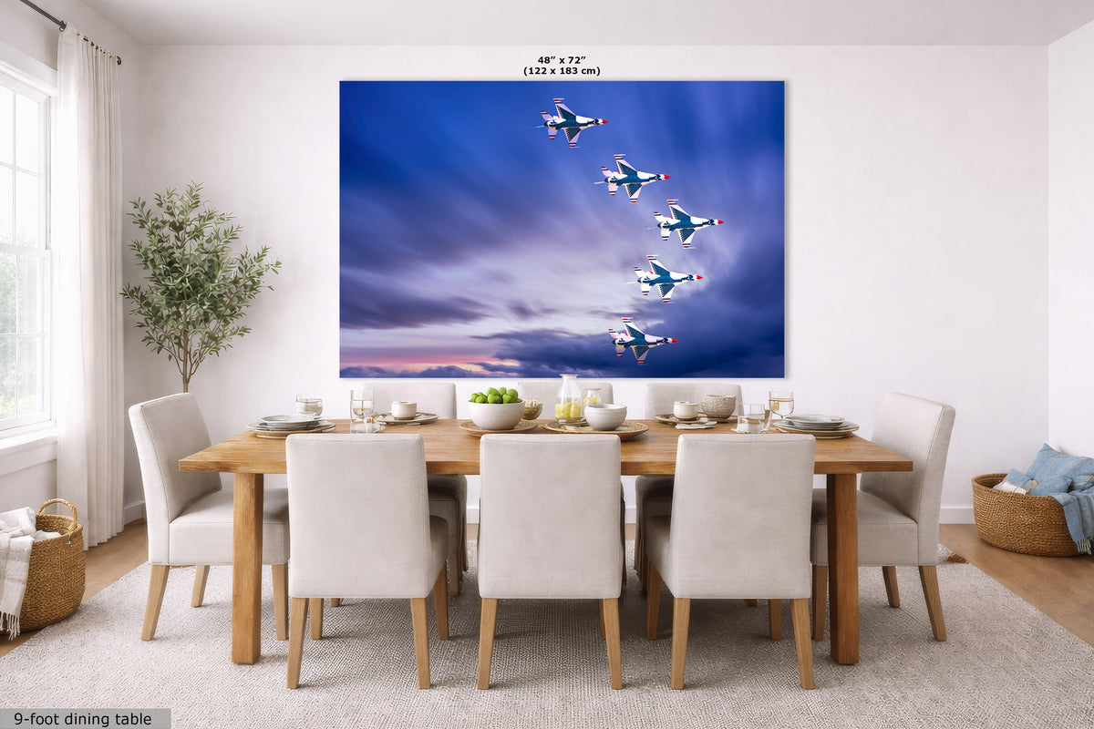 A large wall mural or canvas print depicting six fighter jets flying in a formation against a dramatic blue and purple sky, displayed on a dining room wall above a wooden dining table and chairs.