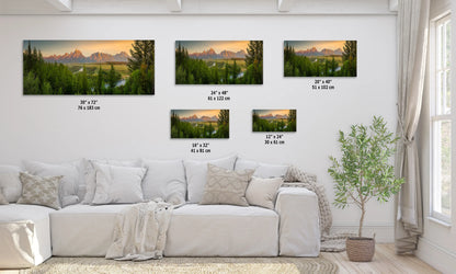 a living room with a white couch and four pictures on the wall