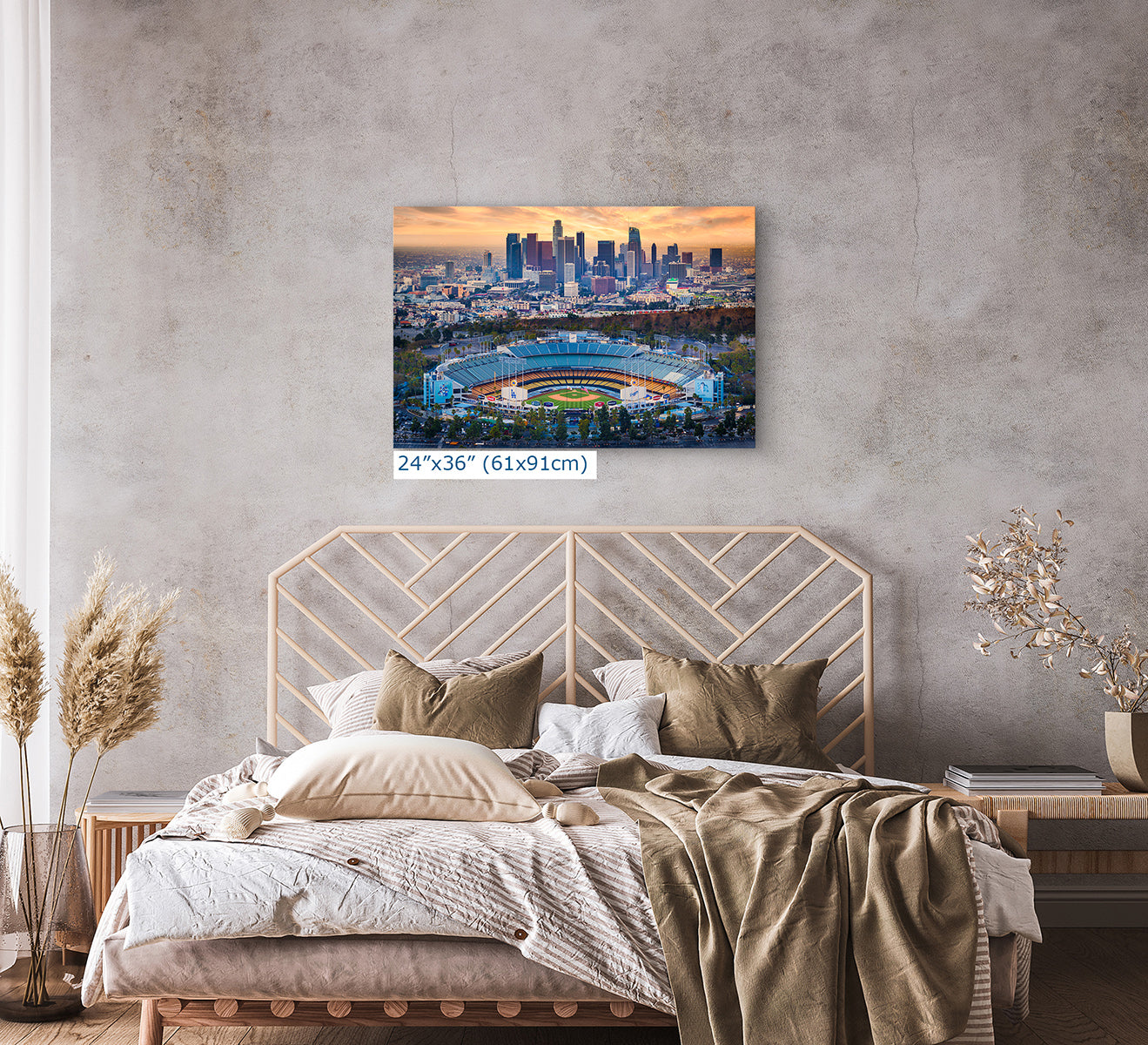 24x36 inch print of Dodger Stadium and the Los Angeles skyline above a modern bedroom with neutral textiles, baseball wall art