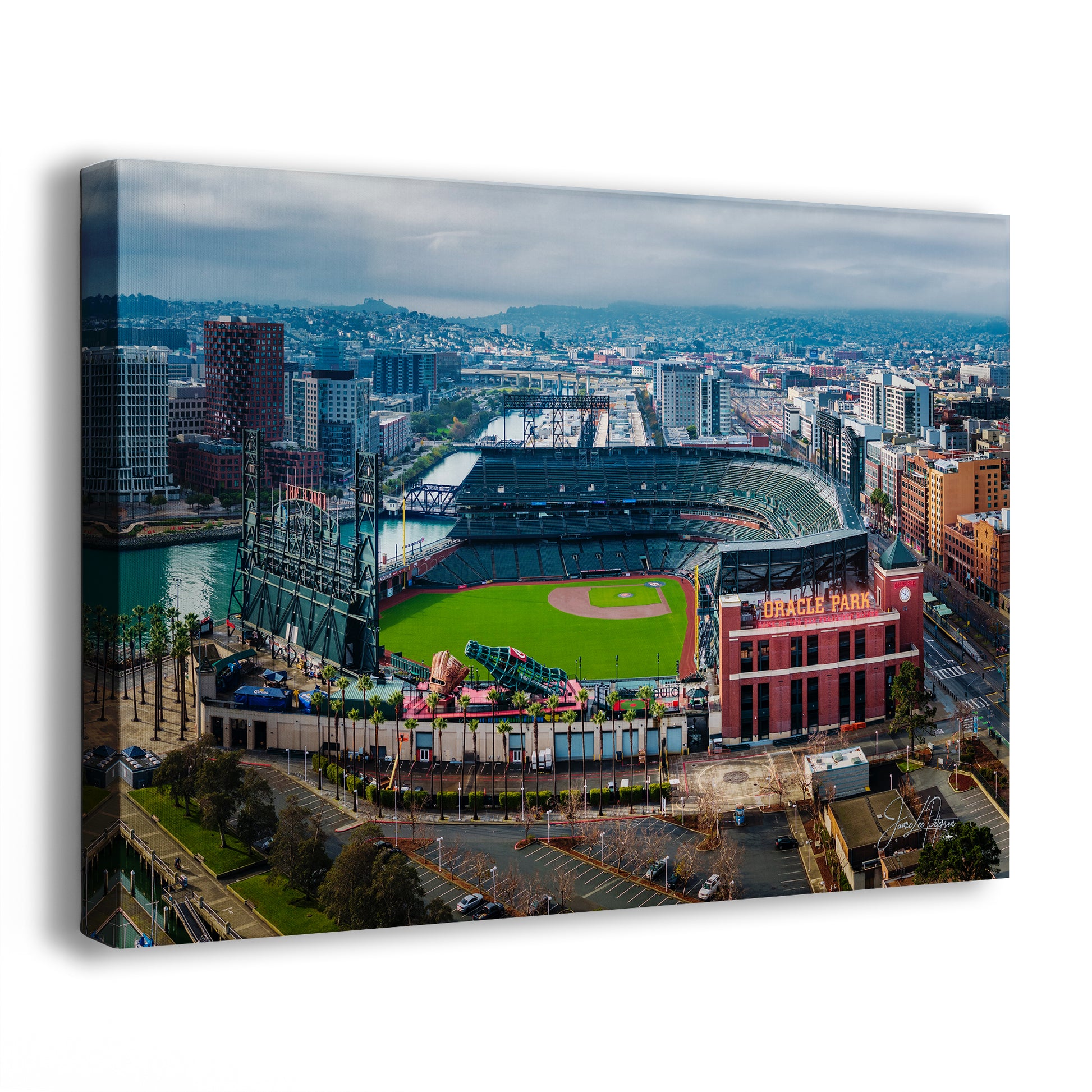 An aerial view of a baseball stadium in a city, with the surrounding buildings and cityscape visible in the background.