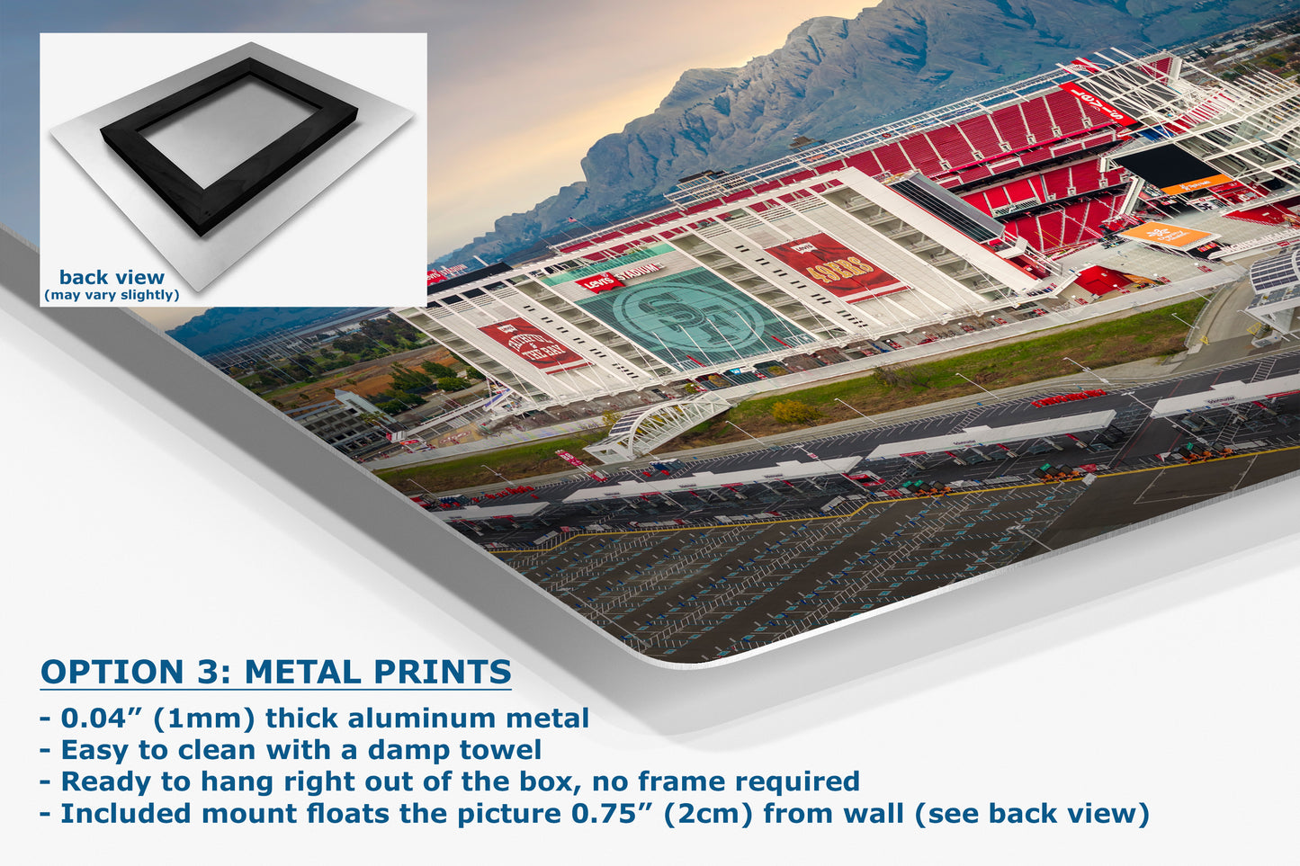 The image is a metal print of a stadium with mountains in the background. The print is described as a 3D print, with a back view showing the stadium and surrounding landscape. The print is made of thick aluminum metal and is easy to clean with a damp towel. It is ready to hang right out of the box, without a frame required. The print is mounted on a wall and includes a mount that floats the picture 0.75" (2.1m) from the wall.