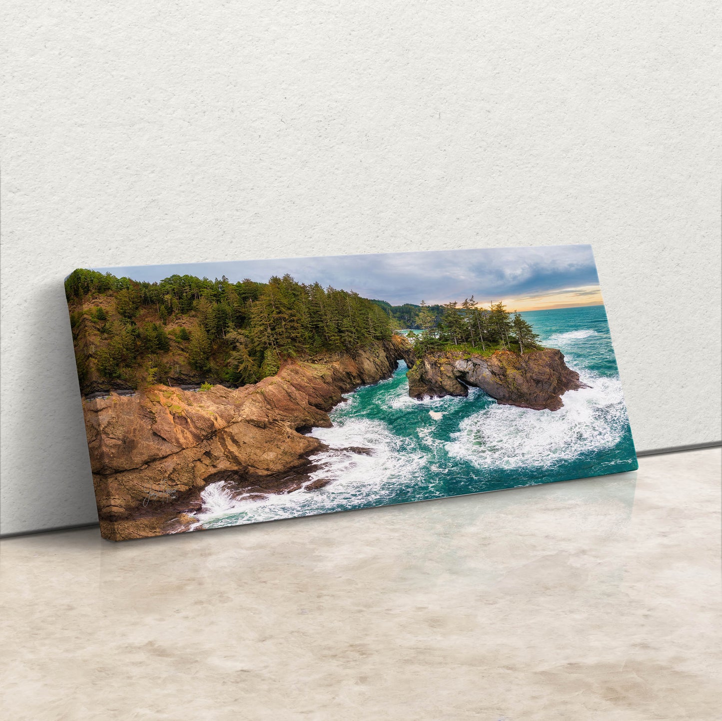 an aerial view of the ocean and a rocky coastline